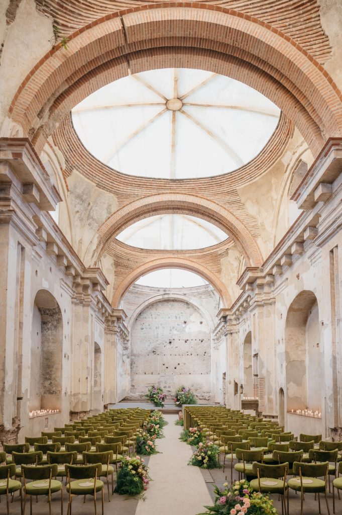 {"type":"elementor","siteurl":"https://daniellopezperez.com/wp-json/","elements":[{"id":"6ccea1a7","elType":"widget","isInner":false,"isLocked":false,"settings":{"editor":"<!-- wp:paragraph -->\n<p>After receiving so much positive feedback for our first article about <a href=\"https://daniellopezperez.com/wedding-venues-on-lake-atitlan-guatemala/\" target=\"_blank\" rel=\"noopener noreferrer\">The Best 15 Wedding Venues on Lake Atitlan</a>. We decided to do the best wedding venues for Antigua Guatemala! Antigua is such a beautiful and unique place to get married. Antigua is full of colorful streets and vistas of looming volcano peaks. This quaint and quiet town is now starting to be recognized as an up-and-coming location for destination weddings.</p>\n<!-- /wp:paragraph --><!-- wp:paragraph -->\n<p>So if you still haven't decided on a wedding venue, definitely keep reading. This list is the ultimate resource to help you find the best wedding venues in Antigua Guatemala.</p>\n<!-- /wp:paragraph --><!-- wp:image {\"id\":9069,\"align\":\"center\"} -->\n<figure class=\"wp-block-image aligncenter\"><img class=\"alignnone wp-image-2021223 size-full\" src=\"https://daniellopezperez.com/wp-content/uploads/2026/04/Best-Wedding-Venues-in-Antigua-Guatemala.jpg\" alt=\"Wedding Ceremony at temple in Santa Clara Ruins in Antigua Guatemala\" width=\"1500\" height=\"998\" /></figure>\n<!-- /wp:image --><!-- wp:paragraph {\"align\":\"center\",\"fontSize\":\"large\"} -->\n<p class=\"has-text-align-center has-large-font-size\"><strong>First Things First</strong></p>\n<!-- /wp:paragraph --><!-- wp:paragraph -->\n<p><strong><em>Our biggest piece of advice for getting married in Antigua is to hire a wedding planner</em></strong>. Especially for couples who are planning from abroad. Having someone who knows the details of booking certain venues, their policies and whether they work for your budget will save you a lot of time and headaches. If you need recommendations for wedding planners, shoot us an email and we will happily send you a list of our favorite planners.</p>\n<!-- /wp:paragraph --><!-- wp:paragraph -->\n<p>When deciding on a wedding venue, be sure to consider a few things. Knowing the size, style and date of your wedding can make all the difference when deciding on the location. Rainy season in Guatemala usually starts around May and goes until October, with a short break in July or August.  Dry season is usually from November until April.</p>\n<!-- /wp:paragraph --><!-- wp:paragraph -->\n<p>We took all the photos in this list. We have covered weddings in all the venues listed.  If you want to see more photos of a particular place, please send us an email. We will happily send you a full wedding gallery.</p>\n<!-- /wp:paragraph --><!-- wp:paragraph -->\n<p>We have divided this list into Ruins and Hotels and included as much relevant information as possible. If you would like more information on a venue, please leave a comment below or contact us! And without further ado, here is our list of best wedding venues in Antigua Guatemala.</p>\n<!-- /wp:paragraph --><!-- wp:heading -->\n<h2 class=\"wp-block-heading\">Ruins</h2>\n<!-- /wp:heading --><!-- wp:list -->\n<ul class=\"wp-block-list\"><!-- wp:list-item -->\n<li><a href=\"#ruins-of-santa-clara\">Ruins of Santa Clara</a></li>\n<!-- /wp:list-item --><!-- wp:list-item -->\n<li><a href=\"#ruins-of-capuchinas\">Ruins of Capuchinas</a></li>\n<!-- /wp:list-item --><!-- wp:list-item -->\n<li><a href=\"#santa-rosa-ruins\">Santa Rosa Ruins / \"Casa de la Ruina\"</a></li>\n<!-- /wp:list-item --><!-- wp:list-item -->\n<li><a href=\"#ruins-of-san-jose-el-viejo\">Ruins of San Jose El Viejo</a></li>\n<!-- /wp:list-item --><!-- wp:list-item -->\n<li><a href=\"#ruins-of-la-recoleccion\">Ruins of La Recoleccion</a></li>\n<!-- /wp:list-item --><!-- wp:list-item -->\n<li><a href=\"#jardin-real-de-santiago\">Jardin Real De Santiago</a></li>\n<!-- /wp:list-item --><!-- wp:list-item -->\n<li><a href=\"#ruins-of-la-ermita\">Ruins of La Ermita</a></li>\n<!-- /wp:list-item --><!-- wp:list-item -->\n<li><a href=\"#ruins-of-san-jeronimo\">Ruins of San Jeronimo</a></li>\n<!-- /wp:list-item --><!-- wp:list-item -->\n<li><a href=\"#ruins-of-la-merced\">Ruins of La Merced</a></li>\n<!-- /wp:list-item --><!-- wp:list-item -->\n<li><a href=\"#ezenario-historico\">Ezenario Historico</a></li>\n<!-- /wp:list-item --><!-- wp:list-item -->\n<li><a href=\"#ruins-of-santa-teresa\">Ruins of Santa Teresa</a></li>\n<!-- /wp:list-item --></ul>\n<!-- /wp:list --><!-- wp:heading -->\n<h2 class=\"wp-block-heading\">Hotels</h2>\n<!-- /wp:heading --><!-- wp:list -->\n<ul class=\"wp-block-list\"><!-- wp:list-item -->\n<li><a href=\"#pensativo-house\">Pensativo House</a></li>\n<!-- /wp:list-item --><!-- wp:list-item -->\n<li><a href=\"#villa-bokeh\">Villa Bokeh</a></li>\n<!-- /wp:list-item --><!-- wp:list-item -->\n<li><a href=\"#porta-hotel\">Porta Hotel</a></li>\n<!-- /wp:list-item --><!-- wp:list-item -->\n<li><a href=\"#hotel-casa-santo-domingo\">Hotel Casa Santo Domingo</a></li>\n<!-- /wp:list-item --><!-- wp:list-item -->\n<li><a href=\"#santo-domingo-del-cerro\">Santo Domingo del Cerro</a></li>\n<!-- /wp:list-item --><!-- wp:list-item -->\n<li><a href=\"#panza-verde\">Panza Verde</a></li>\n<!-- /wp:list-item --><!-- wp:list-item -->\n<li><a href=\"#finca-filadelfia\">Finca Filadelfia</a></li>\n<!-- /wp:list-item --><!-- wp:list-item -->\n<li><a href=\"#conceptio\">Conceptió</a></li>\n<!-- /wp:list-item --><!-- wp:list-item -->\n<li><a href=\"#posada-san-rafael\">Posada San Rafael</a></li>\n<!-- /wp:list-item --><!-- wp:list-item -->\n<li><a href=\"#earth-lodge\">Earth Lodge</a></li>\n<!-- /wp:list-item --><!-- wp:list-item -->\n<li><a href=\"#casa-blanca-glamping\">Casa Blanca Glamping</a></li>\n<!-- /wp:list-item --></ul>\n<!-- /wp:list --><!-- wp:heading -->\n<h2 class=\"wp-block-heading\"><strong>Best wedding venues in Antigua Guatemala ~ Ruins</strong></h2>\n<!-- /wp:heading --><!-- wp:paragraph {\"align\":\"center\"} -->\n<p class=\"has-text-align-center\"><a href=\"#hotels\">(Click here to jump ahead to the list of Hotels)</a></p>\n<!-- /wp:paragraph --><!-- wp:paragraph -->\n<p>The first part of our two-part venue recommendations begins with the gorgeous church ruins that are spotted all over Antigua. These venues are some of our favorite <a href=\"https://daniellopezperez.com/category/wedding/\" target=\"_blank\" rel=\"noopener noreferrer\">locations where we have photographed weddings</a>. The ruins are amazing because they have minimal visual clutter and are centrally located. They are also a blank slate in terms of design and decoration, so the options here are endless.</p>\n<!-- /wp:paragraph --><!-- wp:paragraph -->\n<p> </p>\n<!-- /wp:paragraph --><!-- wp:heading {\"level\":3} -->\n<h3 id=\"ruins-of-santa-clara\" class=\"wp-block-heading\"><strong>Ruins of Santa Clara</strong></h3>\n<!-- /wp:heading --><!-- wp:paragraph -->\n<p>(<a href=\"https://daniellopezperez.com/wedding-santa-clara-antigua-guatemala/\" target=\"_blank\" rel=\"noopener noreferrer\">Click here to see a wedding we photographed in Santa Clara</a>)</p>\n<!-- /wp:paragraph --><!-- wp:paragraph -->\n<p>The Convent of Santa Clara is perhaps one of the most dynamic and stunning locations for a wedding in Antigua. The convent has a wide variety of spaces that function for separate parts of the wedding day. You could literally host your ceremony, cocktail hour, reception, and a separate dance-floor all in different spaces within this complex. The possibilities here are endless.</p>\n<!-- /wp:paragraph --><!-- wp:paragraph -->\n<p>The entirety of Santa Clara includes a beautiful garden with a fountain, a few arched walkways along the sides, a beautiful, temple with an open ceiling and altar, all of which could be used for various special moments throughout the day.</p>\n<!-- /wp:paragraph --><!-- wp:paragraph -->\n<p>Also, just outside the ruins is the Pila Pública or Tanque de la Unión, an infamous yellow washing station where we have photographed many couples who are getting married inside of Santa Clara. This building is a wonder for photos, since it provides a myriad of angles for amazing pictures.</p>\n<!-- /wp:paragraph --><!-- wp:image {\"width\":\"434px\",\"height\":\"auto\",\"sizeSlug\":\"large\",\"align\":\"center\"} -->\n<figure class=\"wp-block-image aligncenter size-large is-resized\"><img style=\"width: 434px; height: auto;\" src=\"https://daniellopezperez.com/wp-content/uploads/2018/10/best-wedding-venues-in-antigua-guatemala-santa-clara-1-683x1024.jpg\" alt=\"\" /></figure>\n<!-- /wp:image --><!-- wp:paragraph -->\n<p>These ruins are great for big and small weddings. But it might be a good idea to use some of the smaller areas for more intimate moments. Santa Clara's main temple used to have an open ceiling, but its domes got covered recently. This may take away some of the beauty, but ultimately it's really good news for being a more suitable venue for rainy days and rainy season (May-November)</p>\n<!-- /wp:paragraph --><!-- wp:paragraph -->\n<p>Still some of the spaces like the <em>claustro</em>(the garden area with the fountain) are not covered. So you might be taking a risk if your wedding is planned during the rainy season and you are planning on having the reception there.</p>\n<!-- /wp:paragraph --><!-- wp:image {\"id\":12006,\"align\":\"center\"} -->\n<figure class=\"wp-block-image aligncenter\"><img class=\"wp-image-12006\" src=\"https://daniellopezperez.com/wp-content/uploads/2018/10/carolineross-daniellopezperez-199-1.jpg\" alt=\"Wedding Reception at Convent of Santa Clara Antigua Guatemala\" /></figure>\n<!-- /wp:image --><!-- wp:image {\"id\":8988,\"align\":\"center\"} -->\n<figure class=\"wp-block-image aligncenter\"><img class=\"wp-image-8988\" src=\"https://daniellopezperez.com/wp-content/uploads/2018/10/justinsarah-daniellopezperez-248-2-1024x765.jpg\" alt=\"Best Wedding Venues to Get Married in Antigua Guatemala 02\" /></figure>\n<!-- /wp:image --><!-- wp:image {\"id\":12008,\"align\":\"center\"} -->\n<figure class=\"wp-block-image aligncenter\"><img class=\"wp-image-12008\" src=\"https://daniellopezperez.com/wp-content/uploads/2018/10/carolineross-daniellopezperez-477-1.jpg\" alt=\"Wedding Ceremony setting in Antigua Guatemala\" /></figure>\n<!-- /wp:image --><!-- wp:image {\"id\":12009,\"align\":\"center\"} -->\n<figure class=\"wp-block-image aligncenter\"><img class=\"wp-image-12009\" src=\"https://daniellopezperez.com/wp-content/uploads/2018/10/matttara-daniellopezperez-344-1.jpg\" alt=\"First Kiss Destination Wedding Antigua Guatemala\" /></figure>\n<!-- /wp:image --><!-- wp:paragraph -->\n<p> </p>\n<!-- /wp:paragraph --><!-- wp:paragraph -->\n<p> </p>\n<!-- /wp:paragraph --><!-- wp:heading {\"level\":3} -->\n<h3 id=\"ruins-of-capuchinas\" class=\"wp-block-heading\"><strong>Ruins of Capuchinas</strong></h3>\n<!-- /wp:heading --><!-- wp:paragraph -->\n<p>(<a href=\"https://daniellopezperez.com/wedding-at-convento-de-capuchinas-antigua-guatemala/\" target=\"_blank\" rel=\"noopener noreferrer\">Click here to see a wedding we photographed in Capuchinas</a>)</p>\n<!-- /wp:paragraph --><!-- wp:paragraph -->\n<p>Much like Santa Clara, the <a href=\"https://daniellopezperez.com/wedding-at-capuchinas-antigua-guatemala/\" target=\"_blank\" rel=\"noreferrer noopener\">Church & Convent of Las Capuchinas has a wide variety of spaces and options to host a wedding</a>. There is a green open garden, a gorgeous two-level courtyard with a fountain right in the middle, and the church/temple which is covered and a great option for the rainy season.</p>\n<!-- /wp:paragraph --><!-- wp:paragraph -->\n<p>The entrance into the temple has two towering wooden doors, making for an epic entrance into a ceremony or onto the dancefloor.</p>\n<!-- /wp:paragraph --><!-- wp:image {\"sizeSlug\":\"large\"} -->\n<figure class=\"wp-block-image size-large\"><img src=\"https://daniellopezperez.com/wp-content/uploads/2018/10/carlossara-daniellopezperez-091-1.jpg\" alt=\"\" /></figure>\n<!-- /wp:image --><!-- wp:paragraph -->\n<p>Capuchinas would be great for a large or small wedding. And if you’re looking to get married during the rainy season. The two-level courtyard provides a great shelter from the rain. As well as a stunning setting for dinner tables or a candlelit walkway. You and your guests also have access to the second level of the courtyard. Which means more quintessential Antiguan backdrops and space for <a href=\"https://photo-logica.com/best-camera-wedding-photography/\">wedding photo</a> opportunities.</p>\n<!-- /wp:paragraph --><!-- wp:image {\"id\":12011,\"align\":\"center\"} -->\n<figure class=\"wp-block-image aligncenter\"><img class=\"wp-image-12011\" src=\"https://daniellopezperez.com/wp-content/uploads/2018/10/monicascott-daniellopezperez-297-2.jpg\" alt=\"Destination wedding convento capuchinas antigua guatemala\" /></figure>\n<!-- /wp:image --><!-- wp:image {\"id\":12012,\"align\":\"center\"} -->\n<figure class=\"wp-block-image aligncenter\"><img class=\"wp-image-12012\" src=\"https://daniellopezperez.com/wp-content/uploads/2018/10/wedding-convento-capuchinas-antigua-guatemala-1.jpg\" alt=\"Destination Wedding Antigua Guatemala\" /></figure>\n<!-- /wp:image --><!-- wp:image {\"id\":10715,\"align\":\"center\"} -->\n<figure class=\"wp-block-image aligncenter\"><img class=\"wp-image-10715\" src=\"https://daniellopezperez.com/wp-content/uploads/2019/09/wedding-convent-capuchinas-antigua-106.jpg\" alt=\"\" /></figure>\n<!-- /wp:image --><!-- wp:image {\"id\":10717,\"align\":\"center\"} -->\n<figure class=\"wp-block-image aligncenter\"><img class=\"wp-image-10717\" src=\"https://daniellopezperez.com/wp-content/uploads/2019/09/wedding-convent-capuchinas-antigua-108.jpg\" alt=\"\" /></figure>\n<!-- /wp:image --><!-- wp:image {\"id\":10716,\"align\":\"center\"} -->\n<figure class=\"wp-block-image aligncenter\"><img class=\"wp-image-10716\" src=\"https://daniellopezperez.com/wp-content/uploads/2019/09/wedding-convent-capuchinas-antigua-107.jpg\" alt=\"\" /></figure>\n<!-- /wp:image --><!-- wp:paragraph -->\n<p> </p>\n<!-- /wp:paragraph --><!-- wp:paragraph -->\n<p> </p>\n<!-- /wp:paragraph --><!-- wp:heading {\"level\":3} -->\n<h3 id=\"santa-rosa-ruins\" class=\"wp-block-heading\"><strong>Santa Rosa Ruins / \"Casa de la Ruina\"</strong></h3>\n<!-- /wp:heading --><!-- wp:paragraph -->\n<p>Casa De La Ruina is a great option for couples looking to be in direct contact with their wedding venue location. Casa de La Ruina is privately owned, meaning you can inquire about dates, ask questions and book directly with the folks that run the venue. The ruin itself is an open-air single-structure, with its own unique charm and feel. Outside the ruin is a spacious garden, with plenty of room for a cocktail or reception.</p>\n<!-- /wp:paragraph --><!-- wp:paragraph -->\n<p>The other unique aspect of Casa de La Ruina is that there is accommodation on site, making it an easy transfer for guests who wish to stay close to the celebration. Also, since it is privately owned, there are fewer limitations on event times, but this is best to sort out directly with them, which you can do on their <a href=\"https://www.instagram.com/lacasadelaruina/\">Instagram Page here</a>.</p>\n<!-- /wp:paragraph --><!-- wp:image {\"id\":1513942,\"sizeSlug\":\"large\",\"linkDestination\":\"none\"} -->\n<figure class=\"wp-block-image size-large\"><img class=\"wp-image-1513942\" src=\"https://daniellopezperez.com/wp-content/uploads/2022/10/ShreyaWill-DanielLopezPerez-242-1024x681.jpg\" alt=\"\" /></figure>\n<!-- /wp:image --><!-- wp:gallery {\"columns\":2,\"linkTo\":\"none\"} -->\n<figure class=\"wp-block-gallery has-nested-images columns-2 is-cropped\"><!-- wp:image {\"id\":1515507,\"sizeSlug\":\"large\",\"linkDestination\":\"none\"} -->\n<figure class=\"wp-block-image size-large\"><img class=\"wp-image-1515507\" src=\"https://daniellopezperez.com/wp-content/uploads/2024/10/ShreyaWill-DanielLopezPerez-165-1024x681.jpg\" alt=\"\" /></figure>\n<!-- /wp:image --></figure>\n<!-- /wp:gallery --><!-- wp:gallery {\"linkTo\":\"none\"} -->\n<figure class=\"wp-block-gallery has-nested-images columns-default is-cropped\"><!-- wp:image {\"id\":1513943,\"sizeSlug\":\"large\",\"linkDestination\":\"none\"} -->\n<figure class=\"wp-block-image size-large\"><img class=\"wp-image-1513943\" src=\"https://daniellopezperez.com/wp-content/uploads/2022/10/ShreyaWill-DanielLopezPerez-407-1024x681.jpg\" alt=\"\" /></figure>\n<!-- /wp:image --></figure>\n<!-- /wp:gallery --><!-- wp:gallery {\"columns\":2,\"linkTo\":\"none\"} -->\n<figure class=\"wp-block-gallery has-nested-images columns-2 is-cropped\"><!-- wp:image {\"id\":1515509,\"sizeSlug\":\"large\",\"linkDestination\":\"none\"} -->\n<figure class=\"wp-block-image size-large\"><img class=\"wp-image-1515509\" src=\"https://daniellopezperez.com/wp-content/uploads/2021/10/BarrettCatherine-DanielLopezPerez-322-683x1024.jpg\" alt=\"\" /></figure>\n<!-- /wp:image --><!-- wp:image {\"id\":1513946,\"sizeSlug\":\"large\",\"linkDestination\":\"none\"} -->\n<figure class=\"wp-block-image size-large\"><img class=\"wp-image-1513946\" src=\"https://daniellopezperez.com/wp-content/uploads/2022/10/BarrettCatherine-DanielLopezPerez-278-1024x681.jpg\" alt=\"\" /></figure>\n<!-- /wp:image --></figure>\n<!-- /wp:gallery --><!-- wp:gallery {\"linkTo\":\"none\",\"sizeSlug\":\"full\"} -->\n<figure class=\"wp-block-gallery has-nested-images columns-default is-cropped\"><!-- wp:image {\"id\":1515510,\"sizeSlug\":\"large\",\"linkDestination\":\"none\"} -->\n<figure class=\"wp-block-image size-large\"><img class=\"wp-image-1515510\" src=\"https://daniellopezperez.com/wp-content/uploads/2024/10/ShreyaWill-DanielLopezPerez-372-1-681x1024.jpg\" alt=\"\" /></figure>\n<!-- /wp:image --></figure>\n<!-- /wp:gallery --><!-- wp:gallery {\"linkTo\":\"none\"} -->\n<figure class=\"wp-block-gallery has-nested-images columns-default is-cropped\"><!-- wp:image {\"id\":1514965,\"sizeSlug\":\"full\",\"linkDestination\":\"none\"} -->\n<figure class=\"wp-block-image size-full\"><img class=\"wp-image-1514965\" src=\"https://daniellopezperez.com/wp-content/uploads/2023/07/BarrettCatherine-DanielLopezPerez-517-copy.jpg\" alt=\"\" /></figure>\n<!-- /wp:image --></figure>\n<!-- /wp:gallery --><!-- wp:paragraph -->\n<p> </p>\n<!-- /wp:paragraph --><!-- wp:paragraph -->\n<p> </p>\n<!-- /wp:paragraph --><!-- wp:heading {\"level\":3} -->\n<h3 id=\"ruins-of-san-jose-el-viejo\" class=\"wp-block-heading\"><strong>Ruins of San Jose El Viejo</strong></h3>\n<!-- /wp:heading --><!-- wp:paragraph -->\n<p>(<a href=\"https://slideshow.daniellopezperez.com/axel-rachel/\" target=\"_blank\" rel=\"noopener noreferrer\">Click here to see a wedding we photographed in San Jose el Viejo</a>)</p>\n<!-- /wp:paragraph --><!-- wp:paragraph -->\n<p>San Jose is a hidden gem in Antigua. It is not open to the public, so very few people ever get to see beyond the beautiful facade and large wooden doorway. Inside San Jose is a stunning high-ceiling temple which looks like it came from an ancient history textbook.</p>\n<!-- /wp:paragraph --><!-- wp:paragraph -->\n<p>The walls of the temple are already equipped with candle fixtures and the small garden in front is perfect for a cocktail hour between the ceremony and reception. All of San Jose El Viejo is covered apart from the courtyard outside, so it’s a nice cozy venue even in the rainy season.</p>\n<!-- /wp:paragraph --><!-- wp:paragraph -->\n<p>The space is perfect for a ceremony and reception for a modest-sized wedding (between 50-150 people). If you’re looking to host a larger event, there is the option of having the ceremony take place at San Jose, then moving the party to Porta Hotel, which is just across the street.</p>\n<!-- /wp:paragraph --><!-- wp:paragraph -->\n<p>One of our favorite things about San Jose is the afternoon light, in the afternoon and just before sunset, when the sun shines in through a couple of windows towards the back of the temple creating a beautifully lit, picture-perfect scene for any wedding ceremony. Hands down, one of the best wedding venues in Antigua Guatemala.</p>\n<!-- /wp:paragraph --><!-- wp:image {\"sizeSlug\":\"large\",\"align\":\"center\"} -->\n<figure class=\"wp-block-image aligncenter size-large\"><img src=\"https://daniellopezperez.com/wp-content/uploads/2018/10/best-wedding-venues-antigua-guatemala-san-jose-el-viejo-1.jpg\" alt=\"\" /></figure>\n<!-- /wp:image --><!-- wp:image {\"sizeSlug\":\"large\",\"align\":\"center\"} -->\n<figure class=\"wp-block-image aligncenter size-large\"><img src=\"https://daniellopezperez.com/wp-content/uploads/2018/10/best-wedding-venues-antigua-guatemala-san-jose-el-viejo-2.jpg\" alt=\"\" /></figure>\n<!-- /wp:image --><!-- wp:image {\"id\":1514973,\"sizeSlug\":\"full\",\"linkDestination\":\"none\"} -->\n<figure class=\"wp-block-image size-full\"><img class=\"wp-image-1514973\" src=\"https://daniellopezperez.com/wp-content/uploads/2023/07/CarlosSharon-DanielLopezPerez-487-2.jpg\" alt=\"\" /></figure>\n<!-- /wp:image --><!-- wp:gallery {\"linkTo\":\"none\"} -->\n<figure class=\"wp-block-gallery has-nested-images columns-default is-cropped\"><!-- wp:image {\"id\":1514974,\"sizeSlug\":\"large\",\"linkDestination\":\"none\"} -->\n<figure class=\"wp-block-image size-large\"><img class=\"wp-image-1514974\" src=\"https://daniellopezperez.com/wp-content/uploads/2023/07/CarlosSharon-DanielLopezPerez-546-1-2-681x1024.jpg\" alt=\"\" /></figure>\n<!-- /wp:image --><!-- wp:image {\"id\":1514975,\"sizeSlug\":\"large\",\"linkDestination\":\"none\"} -->\n<figure class=\"wp-block-image size-large\"><img class=\"wp-image-1514975\" src=\"https://daniellopezperez.com/wp-content/uploads/2023/07/CarlosSharon-DanielLopezPerez-488-1-683x1024.jpg\" alt=\"\" /></figure>\n<!-- /wp:image --></figure>\n<!-- /wp:gallery --><!-- wp:image {\"id\":9013,\"align\":\"center\"} -->\n<figure class=\"wp-block-image aligncenter\"><img class=\"wp-image-9013\" src=\"https://daniellopezperez.com/wp-content/uploads/2018/10/best-wedding-venues-antigua-guatemala-san-jose-el-viejo-2b-1024x684.jpg\" alt=\"\" /></figure>\n<!-- /wp:image --><!-- wp:image {\"id\":9016,\"align\":\"center\"} -->\n<figure class=\"wp-block-image aligncenter\"><img class=\"wp-image-9016\" src=\"https://daniellopezperez.com/wp-content/uploads/2018/10/best-wedding-venues-antigua-guatemala-san-jose-el-viejo-4-1024x765.jpg\" alt=\"\" /></figure>\n<!-- /wp:image --><!-- wp:image {\"id\":12013,\"align\":\"center\"} -->\n<figure class=\"wp-block-image aligncenter\"><img class=\"wp-image-12013\" src=\"https://daniellopezperez.com/wp-content/uploads/2018/10/jessicathomas-daniellopezperez-603-2.jpg\" alt=\"Best Destination Wedding\" /></figure>\n<!-- /wp:image --><!-- wp:paragraph -->\n<p> </p>\n<!-- /wp:paragraph --><!-- wp:paragraph -->\n<p> </p>\n<!-- /wp:paragraph --><!-- wp:heading {\"level\":3} -->\n<h3 id=\"ruins-of-la-recoleccion\" class=\"wp-block-heading\"><strong>Ruins of La Recoleccion</strong></h3>\n<!-- /wp:heading --><!-- wp:paragraph -->\n<p>(<a href=\"https://daniellopezperez.com/engagement-photos-at-ruins-of-la-recoleccion-in-antigua/\" target=\"_blank\" rel=\"noopener noreferrer\">Click here to see an engagement session we photographed at La Recoleccion</a>)</p>\n<!-- /wp:paragraph --><!-- wp:paragraph -->\n<p>We have to admit that we have only ever photographed ONE <a href=\"https://daniellopezperez.com/wedding-photographer-antigua-guatemala-caitlin-jason/\" target=\"_blank\" rel=\"noreferrer noopener\">wedding at La Recoleccion</a> and we have no idea why. Hidden away behind the Antigua market, these ruins look like a lost world among the greenery of the mountains behind it.</p>\n<!-- /wp:paragraph --><!-- wp:paragraph -->\n<p>At the entrance is a long pathway that leads to what was once a church, similarly constructed in the 18<sup>th</sup> century. The church existed intact for less than a decade before an earthquake destroyed it and it was left to ruin.</p>\n<!-- /wp:paragraph --><!-- wp:paragraph -->\n<p>This ruin, however, is one of our favorite places to photograph because of the rocky landscape that exists where a church once stood, creating a backdrop unlike any of the other ruins in Antigua. Giant pieces of the structure lay strewn around a courtyard that looks like it came from an Indiana Jones movie. At the front of the church is a reconstructed archway and staircase—a famously gorgeous frame for a photograph.</p>\n<!-- /wp:paragraph --><!-- wp:paragraph -->\n<p>The entire compound of La Recoleccion is massive and while there is no covered area within La Recoleccion, many of its courtyards and gardens could be used as a space for a canopy or tent for a large wedding reception. And with so much space, La Recoleccion is ideal for an “all-in-one” location as well, which makes it one of the best venues to get married in Antigua Guatemala.</p>\n<!-- /wp:paragraph --><!-- wp:image {\"width\":\"481px\",\"height\":\"auto\",\"sizeSlug\":\"large\",\"align\":\"center\"} -->\n<figure class=\"wp-block-image aligncenter size-large is-resized\"><img style=\"width: 481px; height: auto;\" src=\"https://daniellopezperez.com/wp-content/uploads/2018/10/best-wedding-venues-antigua-guatemala-la-recoleccion-1.jpg\" alt=\"\" /></figure>\n<!-- /wp:image --><!-- wp:gallery {\"linkTo\":\"none\"} -->\n<figure class=\"wp-block-gallery has-nested-images columns-default is-cropped\"><!-- wp:image {\"id\":1514827,\"sizeSlug\":\"large\",\"linkDestination\":\"none\"} -->\n<figure class=\"wp-block-image size-large\"><img class=\"wp-image-1514827\" src=\"https://daniellopezperez.com/wp-content/uploads/2023/07/GregShirley-DanielLopezPerez-150-1-1024x767.jpg\" alt=\"\" /></figure>\n<!-- /wp:image --></figure>\n<!-- /wp:gallery --><!-- wp:image {\"id\":1514824,\"sizeSlug\":\"full\",\"linkDestination\":\"none\"} -->\n<figure class=\"wp-block-image size-full\"><img class=\"wp-image-1514824\" src=\"https://daniellopezperez.com/wp-content/uploads/2023/07/GregShirley-DanielLopezPerez-199-scaled.jpg\" alt=\"\" /></figure>\n<!-- /wp:image --><!-- wp:gallery {\"linkTo\":\"none\",\"align\":\"center\"} -->\n<figure class=\"wp-block-gallery aligncenter has-nested-images columns-default is-cropped\"><!-- wp:image {\"id\":9023,\"sizeSlug\":\"large\",\"linkDestination\":\"none\"} -->\n<figure class=\"wp-block-image size-large\"><img class=\"wp-image-9023\" src=\"https://daniellopezperez.com/wp-content/uploads/2018/10/best-wedding-venues-antigua-guatemala-la-recoleccion-3-1024x683.jpg\" alt=\"Best Wedding Venues to Get Married in Antigua Guatemala 08\" /></figure>\n<!-- /wp:image --></figure>\n<!-- /wp:gallery --><!-- wp:image {\"id\":12014,\"align\":\"center\"} -->\n<figure class=\"wp-block-image aligncenter\"><img class=\"wp-image-12014\" src=\"https://daniellopezperez.com/wp-content/uploads/2018/10/jannettemoshe-daniellopezperez-438-1.jpg\" alt=\"Wedding Couples at La Recoleccion in Antigua Guatemala\" /></figure>\n<!-- /wp:image --><!-- wp:image {\"id\":12015,\"align\":\"center\"} -->\n<figure class=\"wp-block-image aligncenter\"><img class=\"wp-image-12015\" src=\"https://daniellopezperez.com/wp-content/uploads/2018/10/luciasylvain-daniellopezperez-273-1.jpg\" alt=\"Bride and groom walk towards ruins of La Recoleccion in Antigua Guatemala\" /></figure>\n<!-- /wp:image --><!-- wp:image {\"id\":9025,\"sizeSlug\":\"full\",\"align\":\"center\"} -->\n<figure class=\"wp-block-image aligncenter size-full\"><img class=\"wp-image-9025\" src=\"https://daniellopezperez.com/wp-content/uploads/2018/10/best-wedding-venues-antigua-guatemala-la-recoleccion-5.jpg\" alt=\"\" /></figure>\n<!-- /wp:image --><!-- wp:paragraph -->\n<p> </p>\n<!-- /wp:paragraph --><!-- wp:paragraph -->\n<p> </p>\n<!-- /wp:paragraph --><!-- wp:heading {\"level\":3} -->\n<h3 id=\"jardin-real-de-santiago\" class=\"wp-block-heading\"><strong>Jardin Real De Santiago</strong></h3>\n<!-- /wp:heading --><!-- wp:paragraph -->\n<p>(<a href=\"https://slideshow.daniellopezperez.com/gaby-nick/\" target=\"_blank\" rel=\"noopener noreferrer\">Click here to see a wedding we shot at Jardín Real de Santiago, with preparations at Pensativo</a>)</p>\n<!-- /wp:paragraph --><!-- wp:paragraph -->\n<p>While the layout of Jardin Real De Santiago isn’t as large as some of the other ruins in Antigua, its location is right in the city center of Antigua. Its modest size would make for a wonderful wedding venue.</p>\n<!-- /wp:paragraph --><!-- wp:paragraph -->\n<p>Jardin Real is also uncovered, but is right next to Ezenario Historico, which can be rented in conjunction with the ruin as an indoor area for refuge during the rainy season.</p>\n<!-- /wp:paragraph --><!-- wp:paragraph -->\n<p>The <em>jardin</em> (or garden in English) has high, rustic walls along the sides of the garden adorned with bougainvilleas and other flora.</p>\n<!-- /wp:paragraph --><!-- wp:image {\"sizeSlug\":\"large\"} -->\n<figure class=\"wp-block-image size-large\"><img src=\"https://daniellopezperez.com/wp-content/uploads/2018/10/best-wedding-venues-antigua-guatemala-1.jpg\" alt=\"\" /></figure>\n<!-- /wp:image --><!-- wp:paragraph -->\n<p>Its enclosed space makes for a more private event. While also being close to many hotels and famous photo opportunities around Antigua. For example, Jardin Real de Santiago is located within a few blocks of La Merced. Antigua’s famous yellow church as well as the Arch of Santa Catalina, Antigua’s most famous attraction.</p>\n<!-- /wp:paragraph --><!-- wp:image {\"id\":10819,\"align\":\"center\"} -->\n<figure class=\"wp-block-image aligncenter\"><img class=\"wp-image-10819\" src=\"https://daniellopezperez.com/wp-content/uploads/2018/10/bodas-en-real-jardin-de-santiago.jpg\" alt=\"\" /></figure>\n<!-- /wp:image --><!-- wp:gallery {\"linkTo\":\"none\"} -->\n<figure class=\"wp-block-gallery has-nested-images columns-default is-cropped\"><!-- wp:image {\"id\":1515517,\"sizeSlug\":\"large\",\"linkDestination\":\"none\"} -->\n<figure class=\"wp-block-image size-large\"><img class=\"wp-image-1515517\" src=\"https://daniellopezperez.com/wp-content/uploads/2024/10/GabyNick-DanielLopezPerez-396-1024x681.jpg\" alt=\"\" /></figure>\n<!-- /wp:image --><!-- wp:image {\"id\":1515518,\"sizeSlug\":\"large\",\"linkDestination\":\"none\"} -->\n<figure class=\"wp-block-image size-large\"><img class=\"wp-image-1515518\" src=\"https://daniellopezperez.com/wp-content/uploads/2024/10/GabyNick-DanielLopezPerez-443-1-1024x683.jpg\" alt=\"\" /></figure>\n<!-- /wp:image --></figure>\n<!-- /wp:gallery --><!-- wp:image {\"id\":1513962,\"sizeSlug\":\"large\",\"linkDestination\":\"none\"} -->\n<figure class=\"wp-block-image size-large\"><img class=\"wp-image-1513962\" src=\"https://daniellopezperez.com/wp-content/uploads/2022/10/JacquelineJordan-DanielLopezPerez-681-1024x684.jpg\" alt=\"\" /></figure>\n<!-- /wp:image --><!-- wp:heading {\"level\":3} -->\n<h3 id=\"ruins-of-la-ermita\" class=\"wp-block-heading\"><strong>Ruins of La Ermita</strong></h3>\n<!-- /wp:heading --><!-- wp:paragraph -->\n<p>Hidden away just outside of the Antigua’s center are the ruins of La Ermita. These ruins are along a road that runs along the east side of Antigua. This dramatic backdrop isn’t one of the most common ruins to get married in, but they are certainly some of the most beautiful.</p>\n<!-- /wp:paragraph --><!-- wp:paragraph -->\n<p>The amphitheater steps that lead down to the church’s façade make for an amazing frame for a wedding setting. The façade doors open up to an open-ceiling room with tall walls on all four sides. What used to be an old church now just lays the ground for the perfect reception hall for a small wedding.</p>\n<!-- /wp:paragraph --><!-- wp:paragraph -->\n<p>These ruins are not covered, so not a recommended locale during the rainy season. If you could time it perfectly though, La Ermita really seems to pop the most when the trees behind are green and lush. A November wedding here would be absolutely gorgeous. Something else to keep in mind is that there is minimal parking at La Ermita, so transport to and from the venue will be needed.</p>\n<!-- /wp:paragraph --><!-- wp:image {\"id\":1513960,\"sizeSlug\":\"large\",\"linkDestination\":\"none\",\"align\":\"center\"} -->\n<figure class=\"wp-block-image aligncenter size-large\"><img class=\"wp-image-1513960\" src=\"https://daniellopezperez.com/wp-content/uploads/2022/10/TinaTony-DanielLopezPerez-337-1024x681.jpg\" alt=\"wedding ceremony antigua guatemala la ermita\" /></figure>\n<!-- /wp:image --><!-- wp:gallery {\"columns\":2,\"linkTo\":\"none\"} -->\n<figure class=\"wp-block-gallery has-nested-images columns-2 is-cropped\"><!-- wp:image {\"id\":1513957,\"sizeSlug\":\"large\",\"linkDestination\":\"none\"} -->\n<figure class=\"wp-block-image size-large\"><img class=\"wp-image-1513957\" src=\"https://daniellopezperez.com/wp-content/uploads/2022/10/TinaTony-DanielLopezPerez-308-1024x683.jpg\" alt=\"\" /></figure>\n<!-- /wp:image --><!-- wp:image {\"id\":1515523,\"sizeSlug\":\"large\",\"linkDestination\":\"none\"} -->\n<figure class=\"wp-block-image size-large\"><img class=\"wp-image-1515523\" src=\"https://daniellopezperez.com/wp-content/uploads/2024/10/ChuckRose-DanielLopezPerez-408-1024x681.jpg\" alt=\"\" /></figure>\n<!-- /wp:image --></figure>\n<!-- /wp:gallery --><!-- wp:gallery {\"linkTo\":\"none\"} -->\n<figure class=\"wp-block-gallery has-nested-images columns-default is-cropped\"><!-- wp:image {\"id\":1515519,\"sizeSlug\":\"large\",\"linkDestination\":\"none\"} -->\n<figure class=\"wp-block-image size-large\"><img class=\"wp-image-1515519\" src=\"https://daniellopezperez.com/wp-content/uploads/2024/10/ChuckRose-DanielLopezPerez-402-681x1024.jpg\" alt=\"\" /></figure>\n<!-- /wp:image --><!-- wp:image {\"id\":1515521,\"sizeSlug\":\"large\",\"linkDestination\":\"none\"} -->\n<figure class=\"wp-block-image size-large\"><img class=\"wp-image-1515521\" src=\"https://daniellopezperez.com/wp-content/uploads/2024/10/ChuckRose-DanielLopezPerez-448-1-683x1024.jpg\" alt=\"\" /></figure>\n<!-- /wp:image --></figure>\n<!-- /wp:gallery --><!-- wp:image {\"id\":1515522,\"sizeSlug\":\"large\",\"linkDestination\":\"none\"} -->\n<figure class=\"wp-block-image size-large\"><img class=\"wp-image-1515522\" src=\"https://daniellopezperez.com/wp-content/uploads/2024/10/KatRich-DanielLopezPerez-0538-1-1024x681.jpg\" alt=\"\" /></figure>\n<!-- /wp:image --><!-- wp:heading {\"level\":3} -->\n<h3 id=\"ruins-of-san-jeronimo\" class=\"wp-block-heading\"><strong>Ruins of San Jeronimo</strong></h3>\n<!-- /wp:heading --><!-- wp:image {\"id\":1514931,\"sizeSlug\":\"large\",\"linkDestination\":\"none\"} -->\n<figure class=\"wp-block-image size-large\"><img class=\"wp-image-1514931\" src=\"https://daniellopezperez.com/wp-content/uploads/2023/07/LindsayTaylor-DanielLopezPerez-343-1024x682.jpg\" alt=\"\" /></figure>\n<!-- /wp:image --><!-- wp:paragraph -->\n<p>San Jeronimo is one of the smaller convents and churches in ruins in Antigua. This peaceful garden is located just six blocks from the Central Park, right off of the Alameda de Santa Lucia. It's one of the few ruins with a full view of the volcano, with two balconies perched perfectly for a sunset view. <br />The complex has beautiful landscaping, and especially around the central fountain. We recommend San Jeronimo for more intimate weddings, as the spaces around the fountain slightly limit the layout. There is a large garden to the side that allows for a tent if extra space is needed for a reception or cocktail hour.</p>\n<!-- /wp:paragraph --><!-- wp:image {\"id\":1514930,\"sizeSlug\":\"large\",\"linkDestination\":\"none\"} -->\n<figure class=\"wp-block-image size-large\"><img class=\"wp-image-1514930\" src=\"https://daniellopezperez.com/wp-content/uploads/2023/07/LindsayTaylor-DanielLopezPerez-351-1024x682.jpg\" alt=\"\" /></figure>\n<!-- /wp:image --><!-- wp:image {\"id\":1514932,\"sizeSlug\":\"large\",\"linkDestination\":\"none\"} -->\n<figure class=\"wp-block-image size-large\"><img class=\"wp-image-1514932\" src=\"https://daniellopezperez.com/wp-content/uploads/2023/07/LindsayTaylor-DanielLopezPerez-352-1024x682.jpg\" alt=\"\" /></figure>\n<!-- /wp:image --><!-- wp:gallery {\"columns\":2,\"linkTo\":\"none\"} -->\n<figure class=\"wp-block-gallery has-nested-images columns-2 is-cropped\"><!-- wp:image {\"id\":1513950,\"sizeSlug\":\"large\",\"linkDestination\":\"none\"} -->\n<figure class=\"wp-block-image size-large\"><img class=\"wp-image-1513950\" src=\"https://daniellopezperez.com/wp-content/uploads/2022/10/AlyssaDaniel-DanielLopezPerez-449-1024x683.jpg\" alt=\"\" /></figure>\n<!-- /wp:image --><!-- wp:image {\"id\":1513955,\"sizeSlug\":\"large\",\"linkDestination\":\"none\"} -->\n<figure class=\"wp-block-image size-large\"><img class=\"wp-image-1513955\" src=\"https://daniellopezperez.com/wp-content/uploads/2022/10/AlyssaDaniel-DanielLopezPerez-290-1024x681.jpg\" alt=\"\" /></figure>\n<!-- /wp:image --><!-- wp:image {\"id\":1513953,\"sizeSlug\":\"large\",\"linkDestination\":\"none\"} -->\n<figure class=\"wp-block-image size-large\"><img class=\"wp-image-1513953\" src=\"https://daniellopezperez.com/wp-content/uploads/2022/10/AlyssaDaniel-DanielLopezPerez-294-1024x683.jpg\" alt=\"\" /></figure>\n<!-- /wp:image --></figure>\n<!-- /wp:gallery --><!-- wp:paragraph -->\n<p> </p>\n<!-- /wp:paragraph --><!-- wp:heading {\"level\":3} -->\n<h3 id=\"ruins-of-la-merced\" class=\"wp-block-heading\"><strong>Ruins of La Merced</strong></h3>\n<!-- /wp:heading --><!-- wp:paragraph -->\n<p>This is one of the more famous locations in Antigua, because of the church's bright yellow façade that is emblematic of Antigua’s color. La Merced itself consists of a cathedral and ruins, both of which can be rented separately or together. The limitation with the church however, is that they only allow ceremonies there for Catholic couples. You can certainly rent the ruins separately from the church if you’re looking for just a beautiful rustic place for your special day.</p>\n<!-- /wp:paragraph --><!-- wp:paragraph -->\n<p><a href=\"https://daniellopezperez.com/erin-nick-engagement-photograper-antigua-guatemala/\" target=\"_blank\" rel=\"noreferrer noopener\">The ruins at La Merced</a> boast the biggest fountain in Antigua right smack in the middle of the ruins, surrounded by arched pathways on all four sides of the fountain’s courtyard.</p>\n<!-- /wp:paragraph --><!-- wp:image {\"sizeSlug\":\"large\"} -->\n<figure class=\"wp-block-image size-large\"><img src=\"https://daniellopezperez.com/wp-content/uploads/2018/10/luisnikessha-daniellopezperez-161-2-1.jpg\" alt=\"\" /></figure>\n<!-- /wp:image --><!-- wp:paragraph -->\n<p>La Merced has also a stunning second level, from which you have an almost 360 degree view of Antigua. From this second level you also have a view of the three volcanoes seen from Antigua. A rare sight for most of the ruins.</p>\n<!-- /wp:paragraph --><!-- wp:image {\"id\":9032,\"align\":\"center\"} -->\n<figure class=\"wp-block-image aligncenter\"><img class=\"wp-image-9032\" src=\"https://daniellopezperez.com/wp-content/uploads/2018/10/best-wedding-venues-antigua-guatemala-la-merced-1-1024x472.jpg\" alt=\"\" /></figure>\n<!-- /wp:image --><!-- wp:image {\"id\":12017,\"align\":\"center\"} -->\n<figure class=\"wp-block-image aligncenter\"><img class=\"wp-image-12017\" src=\"https://daniellopezperez.com/wp-content/uploads/2018/10/luisnikessha-daniellopezperez-162-1.jpg\" alt=\"Wedding Couple at Ruins of La Merced in Antigua Guatemala\" /></figure>\n<!-- /wp:image --><!-- wp:image {\"id\":12018,\"align\":\"center\"} -->\n<figure class=\"wp-block-image aligncenter\"><img class=\"wp-image-12018\" src=\"https://daniellopezperez.com/wp-content/uploads/2018/10/luisfernandomariarenee-daniellopezperez-386-1.jpg\" alt=\"Bridal Party at Ruins of La Merced in Antigua Guatemala\" /></figure>\n<!-- /wp:image --><!-- wp:image {\"id\":9035,\"align\":\"center\"} -->\n<figure class=\"wp-block-image aligncenter\"><img class=\"wp-image-9035\" src=\"https://daniellopezperez.com/wp-content/uploads/2018/10/best-wedding-venues-antigua-guatemala-la-merced-5-1024x765.jpg\" alt=\"\" /></figure>\n<!-- /wp:image --><!-- wp:paragraph -->\n<p> </p>\n<!-- /wp:paragraph --><!-- wp:paragraph -->\n<p> </p>\n<!-- /wp:paragraph --><!-- wp:heading {\"level\":3} -->\n<h3 id=\"ezenario-historico\" class=\"wp-block-heading\"><strong>Ezenario Historico</strong></h3>\n<!-- /wp:heading --><!-- wp:paragraph -->\n<p>Ezenario is a fairly new location, almost hidden in the center of Antigua, right next to the ruins of Jardin Real de Santiago. The structure was originally built in the 1500’s, but was then restored and converted into a rustic, colorful event space. This venue is great for modest to small sized weddings and contains four different spaces that are available for use.</p>\n<!-- /wp:paragraph --><!-- wp:paragraph -->\n<p><br />The entrance is a grand, tall wooden door that welcomes you into the first hall, which is tinted a celestial blue in the traditional sponge painting style that is often found in Antigua. Then follows two larger, covered spaces that would function perfectly as the reception hall and dance floor. Both have pieces of the original construction on display, complimented by the wooden ceiling & large windows, which provide wonderful natural light during the day.</p>\n<!-- /wp:paragraph --><!-- wp:paragraph -->\n<p><br />Ezenario also has a terrace with great views of the rooftops of Antigua as well as a view of Volcan Agua, as it quietly watches over Antigua. Finally, there is an open-aired patio with a lovely fountain that is emblematic of a typical Antiguan home, with hallways on the sides and no ceiling, perfect for a cocktail hour or ceremony locale</p>\n<!-- /wp:paragraph --><!-- wp:image {\"width\":\"487px\",\"height\":\"auto\",\"sizeSlug\":\"large\",\"align\":\"center\"} -->\n<figure class=\"wp-block-image aligncenter size-large is-resized\"><img style=\"width: 487px; height: auto;\" src=\"https://daniellopezperez.com/wp-content/uploads/2018/10/best-wedding-venues-in-antigua-guatemala-ezenario-historico-1.jpg\" alt=\"\" /></figure>\n<!-- /wp:image --><!-- wp:paragraph -->\n<p>.</p>\n<!-- /wp:paragraph --><!-- wp:image {\"id\":9039,\"align\":\"center\"} -->\n<figure class=\"wp-block-image aligncenter\"><img class=\"wp-image-9039\" src=\"https://daniellopezperez.com/wp-content/uploads/2018/10/best-wedding-venues-in-antigua-guatemala-ezenario-historico-2-1024x472.jpg\" alt=\"\" /></figure>\n<!-- /wp:image --><!-- wp:image {\"id\":9040,\"align\":\"center\"} -->\n<figure class=\"wp-block-image aligncenter\"><img class=\"wp-image-9040\" src=\"https://daniellopezperez.com/wp-content/uploads/2018/10/best-wedding-venues-in-antigua-guatemala-ezenario-historico-3-1024x341.jpg\" alt=\"\" /></figure>\n<!-- /wp:image --><!-- wp:paragraph {\"align\":\"center\"} -->\n<p class=\"has-text-align-center\"><span style=\"color: #ffffff;\"><span style=\"color: #333333;\"> </span>Best wedding Venues in Antigua Guatemala</span></p>\n<!-- /wp:paragraph --><!-- wp:paragraph -->\n<p> </p>\n<!-- /wp:paragraph --><!-- wp:heading {\"level\":3} -->\n<h3 id=\"ruins-of-santa-teresa\" class=\"wp-block-heading\"><strong>Ruins of Santa Teresa</strong></h3>\n<!-- /wp:heading --><!-- wp:paragraph -->\n<p>Santa Teresa is a beautiful courtyard that would be perfect for a modest-sized wedding in Antigua. The courtyard has a lovely fountain right in the middle with those famous arched passageways along all four sides of the courtyard. The rustic look of Santa Teresa is beautiful and can be accompanied with a variety of décor and designs.</p>\n<!-- /wp:paragraph --><!-- wp:paragraph -->\n<p id=\"hotels\">This ruin is also within walking distance to many famous attractions in Antigua, such as La Merced, the arch and Calle Santa Rosa, a beautiful cobblestone street lined with trees and colorful walls that is great for taking pictures.</p>\n<!-- /wp:paragraph --><!-- wp:image {\"sizeSlug\":\"large\"} -->\n<figure class=\"wp-block-image size-large\"><img src=\"https://daniellopezperez.com/wp-content/uploads/2018/10/best-wedding-venues-antigua-guatemala-santa-teresita-01.jpg\" alt=\"\" /></figure>\n<!-- /wp:image --><!-- wp:gallery {\"linkTo\":\"none\"} -->\n<figure class=\"wp-block-gallery has-nested-images columns-default is-cropped\"><!-- wp:image {\"id\":1513933,\"sizeSlug\":\"large\",\"linkDestination\":\"none\"} -->\n<figure class=\"wp-block-image size-large\"><img class=\"wp-image-1513933\" src=\"https://daniellopezperez.com/wp-content/uploads/2022/10/AaronVictoria-DanielLopezPerez-519-1024x682.jpg\" alt=\"\" /></figure>\n<!-- /wp:image --></figure>\n<!-- /wp:gallery --><!-- wp:gallery {\"linkTo\":\"none\"} -->\n<figure class=\"wp-block-gallery has-nested-images columns-default is-cropped\"><!-- wp:image {\"id\":1515525,\"sizeSlug\":\"large\",\"linkDestination\":\"none\"} -->\n<figure class=\"wp-block-image size-large\"><img class=\"wp-image-1515525\" src=\"https://daniellopezperez.com/wp-content/uploads/2021/10/DanielaNico-WelcomeParty-DanielLopezPerez-013-1024x681.jpg\" alt=\"wedding welcome dinner antigua guatemala\" /></figure>\n<!-- /wp:image --><!-- wp:image {\"id\":1515526,\"sizeSlug\":\"large\",\"linkDestination\":\"none\"} -->\n<figure class=\"wp-block-image size-large\"><img class=\"wp-image-1515526\" src=\"https://daniellopezperez.com/wp-content/uploads/2021/10/DanielaNico-WelcomeParty-DanielLopezPerez-035-1024x681.jpg\" alt=\"rehearsal dinner antigua guatemala\" /></figure>\n<!-- /wp:image --></figure>\n<!-- /wp:gallery --><!-- wp:image {\"id\":1515524,\"sizeSlug\":\"large\",\"linkDestination\":\"none\"} -->\n<figure class=\"wp-block-image size-large\"><img class=\"wp-image-1515524\" src=\"https://daniellopezperez.com/wp-content/uploads/2021/10/DanielaNico-WelcomeParty-DanielLopezPerez-022-1024x681.jpg\" alt=\"luxury wedding events antigua guatemala\" /></figure>\n<!-- /wp:image --><!-- wp:image {\"id\":9048,\"align\":\"center\"} -->\n<figure class=\"wp-block-image aligncenter\"><img class=\"wp-image-9048\" src=\"https://daniellopezperez.com/wp-content/uploads/2018/10/best-wedding-venues-antigua-guatemala-santa-teresita-02-1024x341.jpg\" alt=\"\" /></figure>\n<!-- /wp:image --><!-- wp:heading {\"align\":\"center\"} -->\n<h2 class=\"wp-block-heading\"><strong>Best wedding venues in Antigua Guatemala ~ Hotels</strong></h2>\n<!-- /wp:heading --><!-- wp:paragraph -->\n<p>The second half of our list of best wedding venues in Antigua Guatemala includes hotels and rentals. All of these locations provide some accommodation as well as the convenience of a kitchen or restaurant on-site. However, you might want to check with the venue itself regarding catering for your wedding. Especially if you are looking for something larger or outside of the hotel’s kitchen capacity.</p>\n<!-- /wp:paragraph --><!-- wp:paragraph -->\n<p>Most of these hotels also have options for indoor and outdoor spaces. Which means you’ll have less to worry about if you’re getting married during or around the rainy season.</p>\n<!-- /wp:paragraph --><!-- wp:paragraph -->\n<p> </p>\n<!-- /wp:paragraph --><!-- wp:heading {\"level\":3} -->\n<h3 id=\"pensativo-house\" class=\"wp-block-heading\"><strong>Pensativo House</strong></h3>\n<!-- /wp:heading --><!-- wp:paragraph -->\n<p>(<a href=\"https://slideshow.daniellopezperez.com/luke-maria/\" target=\"_blank\" rel=\"noopener noreferrer\">Click here to see a wedding that we photographed at Pensativo</a>)</p>\n<!-- /wp:paragraph --><!-- wp:paragraph -->\n<p>Built out of the previous home of a Guatemalan military general, Pensativo House Hotel is a quiet yet luxurious place to get married in Antigua. With gorgeous white architecture inspired from the ruins around Antigua, Pensativo House is an elegant location where you can host a ceremony, cocktail hour, reception & even the after party all in the same location.</p>\n<!-- /wp:paragraph --><!-- wp:paragraph -->\n<p>With plenty of spaces to choose from, Pensativo would be great for small and medium-sized weddings (maximum 250 people.) There are also a number incredibly well-lit rooms which are lavishly designed, great for getting ready and pre-wedding photographs.</p>\n<!-- /wp:paragraph --><!-- wp:paragraph -->\n<p>The courtyards are some of the most beautiful spaces for cocktail hours and receptions that we have seen, with heavy greenery and clean architecture on all sides for a perfectly glamorous event. Pensativo House Hotel also has a large terrace with views facing directly towards Agua volcano, amazing for open-air ceremonies. All in all, Pensativo is surely one of the best wedding venues in Antigua Guatemala.</p>\n<!-- /wp:paragraph --><!-- wp:image {\"sizeSlug\":\"large\"} -->\n<figure class=\"wp-block-image size-large\"><img src=\"https://daniellopezperez.com/wp-content/uploads/2018/10/lukemaria-daniellopezperez-173-1.jpg\" alt=\"\" /></figure>\n<!-- /wp:image --><!-- wp:image {\"sizeSlug\":\"large\"} -->\n<figure class=\"wp-block-image size-large\"><img src=\"https://daniellopezperez.com/wp-content/uploads/2018/10/gabynick-daniellopezperez-153-1.jpg\" alt=\"\" /></figure>\n<!-- /wp:image --><!-- wp:image {\"id\":9057,\"align\":\"center\"} -->\n<figure class=\"wp-block-image aligncenter\"><img class=\"wp-image-9057\" src=\"https://daniellopezperez.com/wp-content/uploads/2018/10/dustinnadia-daniellopezperez-009-1.jpg\" alt=\"\" /></figure>\n<!-- /wp:image --><!-- wp:gallery {\"linkTo\":\"none\"} -->\n<figure class=\"wp-block-gallery has-nested-images columns-default is-cropped\"><!-- wp:image {\"id\":1515532,\"sizeSlug\":\"large\",\"linkDestination\":\"none\"} -->\n<figure class=\"wp-block-image size-large\"><img class=\"wp-image-1515532\" src=\"https://daniellopezperez.com/wp-content/uploads/2024/10/BenMariana-DanielLopezPerez-569-1024x681.jpg\" alt=\"\" /></figure>\n<!-- /wp:image --></figure>\n<!-- /wp:gallery --><!-- wp:image {\"id\":11938,\"align\":\"center\"} -->\n<figure class=\"wp-block-image aligncenter\"><img class=\"wp-image-11938\" src=\"https://daniellopezperez.com/wp-content/uploads/2018/10/wedding-photographer-antigua-guatemala-2-1.jpg\" alt=\"Best wedding venues antigua guatemala\" /></figure>\n<!-- /wp:image --><!-- wp:image {\"id\":11936,\"align\":\"center\"} -->\n<figure class=\"wp-block-image aligncenter\"><img class=\"wp-image-11936\" src=\"https://daniellopezperez.com/wp-content/uploads/2018/10/wedding-photographer-antigua-guatemala-8.jpg\" alt=\"Same sex couple during their destination wedding in antigua guatemala\" /></figure>\n<!-- /wp:image --><!-- wp:image {\"id\":9061,\"align\":\"center\"} -->\n<figure class=\"wp-block-image aligncenter\"><img class=\"wp-image-9061\" src=\"https://daniellopezperez.com/wp-content/uploads/2018/10/wedding-photographer-murcia_0300-1024x472.jpg\" alt=\"\" /></figure>\n<!-- /wp:image --><!-- wp:gallery {\"linkTo\":\"none\"} -->\n<figure class=\"wp-block-gallery has-nested-images columns-default is-cropped\"><!-- wp:image {\"id\":1515533,\"sizeSlug\":\"large\",\"linkDestination\":\"none\"} -->\n<figure class=\"wp-block-image size-large\"><img class=\"wp-image-1515533\" src=\"https://daniellopezperez.com/wp-content/uploads/2024/10/BobbyJocelyn-DanielLopezPerez-356-1024x683.jpg\" alt=\"\" /></figure>\n<!-- /wp:image --></figure>\n<!-- /wp:gallery --><!-- wp:paragraph -->\n<p><span style=\"color: #ffffff;\">Best wedding Venues to Get Married in Antigua Guatemala</span></p>\n<!-- /wp:paragraph --><!-- wp:heading {\"level\":3} -->\n<h3 id=\"villa-bokeh\" class=\"wp-block-heading\"><strong>Villa Bokeh</strong></h3>\n<!-- /wp:heading --><!-- wp:paragraph -->\n<p><a href=\"https://daniellopezperez.com/boda-en-villa-bokeh-antigua-guatemala/\">Click here to see a full wedding at Villa Bokeh</a></p>\n<!-- /wp:paragraph --><!-- wp:paragraph -->\n<p>Villa Bokeh is Antigua's only Relais & Chateaux venue. This gorgeous château embraces a lush, private landscape with a spectacular, volcanic panorama. The gardens, patios, and interlaced ponds create the perfect environment for romantic weddings and dreamy events.</p>\n<!-- /wp:paragraph --><!-- wp:paragraph -->\n<p>The overall design and style show impeccable attention to detail. Each of the rooms has its own particular flair and style, all with the comforts of luxury service. The villa also offers in-house catering menus that best match your dream event plan.</p>\n<!-- /wp:paragraph --><!-- wp:gallery {\"linkTo\":\"none\"} -->\n<figure class=\"wp-block-gallery has-nested-images columns-default is-cropped\"><!-- wp:image {\"id\":1515537,\"sizeSlug\":\"large\",\"linkDestination\":\"none\"} -->\n<figure class=\"wp-block-image size-large\"><img class=\"wp-image-1515537\" src=\"https://daniellopezperez.com/wp-content/uploads/2024/10/AnnaJacob-DanielLopezPerez-004-1024x681.jpg\" alt=\"\" /></figure>\n<!-- /wp:image --></figure>\n<!-- /wp:gallery --><!-- wp:gallery {\"linkTo\":\"none\"} -->\n<figure class=\"wp-block-gallery has-nested-images columns-default is-cropped\"><!-- wp:image {\"id\":1513975,\"sizeSlug\":\"large\",\"linkDestination\":\"none\"} -->\n<figure class=\"wp-block-image size-large\"><img class=\"wp-image-1513975\" src=\"https://daniellopezperez.com/wp-content/uploads/2022/10/AnnaJacob-DanielLopezPerez-322-1024x681.jpg\" alt=\"\" /></figure>\n<!-- /wp:image --></figure>\n<!-- /wp:gallery --><!-- wp:gallery {\"columns\":2,\"linkTo\":\"none\"} -->\n<figure class=\"wp-block-gallery has-nested-images columns-2 is-cropped\"><!-- wp:image {\"id\":1513971,\"sizeSlug\":\"large\",\"linkDestination\":\"none\"} -->\n<figure class=\"wp-block-image size-large\"><img class=\"wp-image-1513971\" src=\"https://daniellopezperez.com/wp-content/uploads/2022/10/IsaJorge-DanielLopezPerez-574-1024x684.jpg\" alt=\"\" /></figure>\n<!-- /wp:image --><!-- wp:image {\"id\":1513969,\"sizeSlug\":\"large\",\"linkDestination\":\"none\"} -->\n<figure class=\"wp-block-image size-large\"><img class=\"wp-image-1513969\" src=\"https://daniellopezperez.com/wp-content/uploads/2022/10/IsaJorge-DanielLopezPerez-560-1024x684.jpg\" alt=\"\" /></figure>\n<!-- /wp:image --><!-- wp:image {\"id\":1513968,\"sizeSlug\":\"large\",\"linkDestination\":\"none\"} -->\n<figure class=\"wp-block-image size-large\"><img class=\"wp-image-1513968\" src=\"https://daniellopezperez.com/wp-content/uploads/2022/10/IsaJorge-DanielLopezPerez-554-1024x684.jpg\" alt=\"\" /></figure>\n<!-- /wp:image --><!-- wp:image {\"id\":1513970,\"sizeSlug\":\"large\",\"linkDestination\":\"none\"} -->\n<figure class=\"wp-block-image size-large\"><img class=\"wp-image-1513970\" src=\"https://daniellopezperez.com/wp-content/uploads/2022/10/IsaJorge-DanielLopezPerez-539-1024x684.jpg\" alt=\"\" /></figure>\n<!-- /wp:image --></figure>\n<!-- /wp:gallery --><!-- wp:gallery {\"linkTo\":\"none\"} -->\n<figure class=\"wp-block-gallery has-nested-images columns-default is-cropped\"><!-- wp:image {\"id\":1513974,\"sizeSlug\":\"large\",\"linkDestination\":\"none\"} -->\n<figure class=\"wp-block-image size-large\"><img class=\"wp-image-1513974\" src=\"https://daniellopezperez.com/wp-content/uploads/2022/10/AnnaJacob-DanielLopezPerez-337-1024x681.jpg\" alt=\"\" /></figure>\n<!-- /wp:image --></figure>\n<!-- /wp:gallery --><!-- wp:paragraph -->\n<p> </p>\n<!-- /wp:paragraph --><!-- wp:heading {\"level\":3} -->\n<h3 id=\"porta-hotel\" class=\"wp-block-heading\"><strong>Porta Hotel</strong></h3>\n<!-- /wp:heading --><!-- wp:paragraph -->\n<p>Within a short walk from Pensativo is Porta Hotels, which also a large fully-equipped hotel and venue in its own right. Porta is across the street from San Jose El Viejo, with a large courtyard facing the ruins. This courtyard gives you the backdrop of ancient ruins, without having to bother renting them. Porta also has a wide variety of rooms and a large event space with a capacity of almost 450 people, making it a great choice for a large wedding.</p>\n<!-- /wp:paragraph --><!-- wp:paragraph -->\n<p>When it comes to food, Porta is one of the frontrunners for catering in Antigua, so there will not be limits on choices at dinnertime. There is also a full bar, swimming pool, restaurant, onsite parking and much more which will keep your guests occupied on the days around the wedding.</p>\n<!-- /wp:paragraph --><!-- wp:image {\"sizeSlug\":\"large\"} -->\n<figure class=\"wp-block-image size-large\"><img src=\"https://daniellopezperez.com/wp-content/uploads/2018/10/bestweddingvenuesantiguaguatemala-3-1024x684.jpg\" alt=\"\" /></figure>\n<!-- /wp:image --><!-- wp:gallery {\"linkTo\":\"none\"} -->\n<figure class=\"wp-block-gallery has-nested-images columns-default is-cropped\"><!-- wp:image {\"id\":1515536,\"sizeSlug\":\"large\",\"linkDestination\":\"none\"} -->\n<figure class=\"wp-block-image size-large\"><img class=\"wp-image-1515536\" src=\"https://daniellopezperez.com/wp-content/uploads/2024/10/ForrestRachel-DanielLopezPerez-241-1024x683.jpg\" alt=\"\" /></figure>\n<!-- /wp:image --><!-- wp:image {\"id\":1515535,\"sizeSlug\":\"large\",\"linkDestination\":\"none\"} -->\n<figure class=\"wp-block-image size-large\"><img class=\"wp-image-1515535\" src=\"https://daniellopezperez.com/wp-content/uploads/2024/10/ForrestRachel-DanielLopezPerez-244-684x1024.jpg\" alt=\"\" /></figure>\n<!-- /wp:image --></figure>\n<!-- /wp:gallery --><!-- wp:image {\"id\":12021,\"align\":\"center\"} -->\n<figure class=\"wp-block-image aligncenter\"><img class=\"wp-image-12021\" src=\"https://daniellopezperez.com/wp-content/uploads/2018/10/emilyyefri-daniellopezperez-490.jpg\" alt=\"Wedding Reception at Porta Hotel In Antigua Guatemala\" /></figure>\n<!-- /wp:image --><!-- wp:gallery {\"linkTo\":\"none\",\"align\":\"center\"} -->\n<figure class=\"wp-block-gallery aligncenter has-nested-images columns-default is-cropped\"><!-- wp:image {\"id\":9076,\"sizeSlug\":\"large\",\"linkDestination\":\"none\"} -->\n<figure class=\"wp-block-image size-large\"><img class=\"wp-image-9076\" src=\"https://daniellopezperez.com/wp-content/uploads/2018/10/wedding-photographer-murcia_0303-1024x683.jpg\" alt=\"Donde casarse Antigua Guatemala\" /></figure>\n<!-- /wp:image --><!-- wp:image {\"id\":1515534,\"sizeSlug\":\"large\",\"linkDestination\":\"none\"} -->\n<figure class=\"wp-block-image size-large\"><img class=\"wp-image-1515534\" src=\"https://daniellopezperez.com/wp-content/uploads/2024/10/FrancoKatie-DanielLopezPerez-595-1024x681.jpg\" alt=\"\" /></figure>\n<!-- /wp:image --></figure>\n<!-- /wp:gallery --><!-- wp:paragraph -->\n<p><br />Porta is also a great choice if you’re looking for an all-in-one place for your event. Since it has everything that you’ll need onsite. This hotel also has a staff that is solely dedicated to helping out with the planning of weddings and events. However, we still recommend hiring a wedding planner in Antigua for support with travel logistics, décor & small details.</p>\n<!-- /wp:paragraph --><!-- wp:paragraph -->\n<p> </p>\n<!-- /wp:paragraph --><!-- wp:heading {\"level\":3} -->\n<h3 id=\"villa-bokeh\" class=\"wp-block-heading\"> </h3>\n<!-- /wp:heading --><!-- wp:heading {\"level\":3} -->\n<h3 id=\"hotel-casa-santo-domingo\" class=\"wp-block-heading\">H<strong>otel Casa Santo Domingo</strong></h3>\n<!-- /wp:heading --><!-- wp:paragraph -->\n<p><a href=\"https://daniellopezperez.com/wedding-at-santo-domingo-antigua-guatemala/\" target=\"_blank\" rel=\"noopener noreferrer\">Click here to see a wedding we photographed at Santo Domingo</a>)</p>\n<!-- /wp:paragraph --><!-- wp:paragraph -->\n<p>Santo Domingo is perhaps one of the most <a href=\"https://daniellopezperez.com/wedding-photographer-antigua-guatemala-alex-yasmin/\" target=\"_blank\" rel=\"noreferrer noopener\">famous locations to get married in Antigua Guatemala</a>. We have heard from multiple brides that they had “dreamed of their wedding as a child at Santo Domingo” since it simply is a historic location for a wedding. The hotel grounds include the ruins of a monastery & museum of the same name, as well as many other amenities for your guests and wedding day.</p>\n<!-- /wp:paragraph --><!-- wp:paragraph -->\n<p>Santo Domingo has a huge range of options for large and small weddings, but we think that it really suits larger weddings better. Ceremonies normally take place in front of the chapel façade, one of the most ornate and beautiful backdrops for a wedding you can imagine. Receptions normally take place in the Convention Center, a large room capable of hosting more than 500 people (probably more, but that’s the biggest we have seen there.) There is another, more open space that is available for smaller events that is also in a different section of the hotel, which has a lovely outdoor courtyard and ample space for seating around 100-200 people (<a href=\"https://daniellopezperez.com/wedding-photographer-antigua-guatemala-alex-yasmin/\">check out Alex & Yasmin’s wedding to see an example of this reception space</a>.)</p>\n<!-- /wp:paragraph --><!-- wp:paragraph -->\n<p> </p>\n<!-- /wp:paragraph --><!-- wp:image {\"width\":\"491px\",\"height\":\"auto\",\"sizeSlug\":\"large\",\"align\":\"center\"} -->\n<figure class=\"wp-block-image aligncenter size-large is-resized\"><img style=\"width: 491px; height: auto;\" src=\"https://daniellopezperez.com/wp-content/uploads/2018/10/wedding-hotel-casa-santo-domingo-683x1024.jpg\" alt=\"\" /></figure>\n<!-- /wp:image --><!-- wp:paragraph -->\n<p>Cocktail hours are perfect in the outdoor courtyard under the shade of a huge Ceiba tree. Which is Guatemala’s national tree. During an afternoon or candlelit evening, this courtyard is a spectacular location for your guests to wait for the reception.</p>\n<!-- /wp:paragraph --><!-- wp:paragraph -->\n<p>Since Santo Domingo has been a staple in the wedding industry of Antigua for ages. They also have onsite catering, bars and staff to help you plan your big day. But as always, we highly recommend an outside planner to help with logistics and communication throughout planning. <span style=\"color: #ffffff;\">Best wedding Venues in Antigua Guatemala</span></p>\n<!-- /wp:paragraph --><!-- wp:image {\"id\":12022,\"align\":\"center\"} -->\n<figure class=\"wp-block-image aligncenter\"><img class=\"wp-image-12022\" src=\"https://daniellopezperez.com/wp-content/uploads/2018/10/nataliarodrigo-daniellopezperez-018-1.jpg\" alt=\"Wedding Dress Hangs at Hotel Casa Santo Domingo in Antigua Guatemala\" /></figure>\n<!-- /wp:image --><!-- wp:image {\"id\":12023,\"align\":\"center\"} -->\n<figure class=\"wp-block-image aligncenter\"><img class=\"wp-image-12023\" src=\"https://daniellopezperez.com/wp-content/uploads/2018/10/alexalexa-daniellopezperez-001-1.jpg\" alt=\"Welcome Garden at Hotel Casa Santo Domingo in Antigua Guatemala\" /></figure>\n<!-- /wp:image --><!-- wp:image {\"id\":9087,\"align\":\"center\"} -->\n<figure class=\"wp-block-image aligncenter\"><img class=\"wp-image-9087\" src=\"https://daniellopezperez.com/wp-content/uploads/2018/10/wedding-photographer-antigua-guatemala-3-1024x683.jpg\" alt=\"Best Wedding Venue Antigua Guatemala\" /></figure>\n<!-- /wp:image --><!-- wp:image {\"id\":9084,\"align\":\"center\"} -->\n<figure class=\"wp-block-image aligncenter\"><img class=\"wp-image-9084\" src=\"https://daniellopezperez.com/wp-content/uploads/2018/10/wedding-photographer-antigua-guatemala-1024x684.jpg\" alt=\"Best Wedding Venues Antigua Guatemala\" /></figure>\n<!-- /wp:image --><!-- wp:image {\"id\":11962,\"align\":\"center\"} -->\n<figure class=\"wp-block-image aligncenter\"><img class=\"wp-image-11962\" src=\"https://daniellopezperez.com/wp-content/uploads/2018/10/wedding-hotel-casa-santo-domingo-antigua-guatemala.jpg\" alt=\"Wedding Ceremony Hotel Casa Santo Domingo\" /></figure>\n<!-- /wp:image --><!-- wp:image {\"id\":12024,\"align\":\"center\"} -->\n<figure class=\"wp-block-image aligncenter\"><img class=\"wp-image-12024\" src=\"https://daniellopezperez.com/wp-content/uploads/2018/10/alexdaniela-daniellopezperez-519-1.jpg\" alt=\"Wedding Reception at Hotel Casa Santo Domingo\" /></figure>\n<!-- /wp:image --><!-- wp:image {\"id\":12025,\"align\":\"center\"} -->\n<figure class=\"wp-block-image aligncenter\"><img class=\"wp-image-12025\" src=\"https://daniellopezperez.com/wp-content/uploads/2018/10/anaphilippe-daniellopezperez-585-1.jpg\" alt=\"Hotel Casa Santo Domingo Wedding Antigua Guatemala\" /></figure>\n<!-- /wp:image --><!-- wp:paragraph -->\n<p> </p>\n<!-- /wp:paragraph --><!-- wp:heading {\"level\":3} -->\n<h3 id=\"santo-domingo-del-cerro\" class=\"wp-block-heading\"><strong>Santo Domingo del Cerro</strong></h3>\n<!-- /wp:heading --><!-- wp:paragraph -->\n<p>In addition to the huge amount of amenities that Santo Domingo offers, there is also an entirely different venue, at an offsite location on a hill above Antigua. This means that you’ll get the same sort of service, food and comfort of a wedding at Santo Domingo, just with a change of scenery.</p>\n<!-- /wp:paragraph --><!-- wp:paragraph -->\n<p>While there are no rooms up at El Cerro, there is a large covered reception area that can accommodate a large wedding celebration. The space is surrounded by a curved balcony, from which your guests can enjoy the view or take in a bit of fresh air during the party. Below this structure is where the majority of the ceremonies happen, all with the view of the city below.</p>\n<!-- /wp:paragraph --><!-- wp:image {\"sizeSlug\":\"large\"} -->\n<figure class=\"wp-block-image size-large\"><img src=\"https://daniellopezperez.com/wp-content/uploads/2018/10/wedding-santo-domingo-el-cerro-1024x682.jpg\" alt=\"\" /></figure>\n<!-- /wp:image --><!-- wp:paragraph -->\n<p>There are sprawling gardens that surround El Cerro as well. Where you can find statues and sculptures created by renowned Guatemalan artists. When it’s time for the celebration to end. The staff (or your planner) can help you coordinate the 10-15 minute transport. From the top of the hill back down to the hotel or wherever your guests are staying for the evening.</p>\n<!-- /wp:paragraph --><!-- wp:image {\"id\":9092,\"align\":\"center\"} -->\n<figure class=\"wp-block-image aligncenter\"><img class=\"wp-image-9092\" src=\"https://daniellopezperez.com/wp-content/uploads/2018/10/wedding-casa-santo-domingo-el-cerro-1024x685.jpg\" alt=\"Wedding Santo Domingo El Cerro\" /></figure>\n<!-- /wp:image --><!-- wp:image {\"id\":9093,\"align\":\"center\"} -->\n<figure class=\"wp-block-image aligncenter\"><img class=\"wp-image-9093\" src=\"https://daniellopezperez.com/wp-content/uploads/2018/10/wedding-casa-santo-domingo-el-cerro-2-1024x341.jpg\" alt=\"Wedding Casa Santo Domingo El Cerro\" /></figure>\n<!-- /wp:image --><!-- wp:image {\"id\":1514879,\"sizeSlug\":\"large\",\"linkDestination\":\"none\"} -->\n<figure class=\"wp-block-image size-large\"><img class=\"wp-image-1514879\" src=\"https://daniellopezperez.com/wp-content/uploads/2023/07/KatRich-DanielLopezPerez-0955-2-1024x681.jpg\" alt=\"\" /></figure>\n<!-- /wp:image --><!-- wp:gallery {\"linkTo\":\"none\"} -->\n<figure class=\"wp-block-gallery has-nested-images columns-default is-cropped\"><!-- wp:image {\"id\":1514877,\"sizeSlug\":\"large\",\"linkDestination\":\"none\"} -->\n<figure class=\"wp-block-image size-large\"><img class=\"wp-image-1514877\" src=\"https://daniellopezperez.com/wp-content/uploads/2023/07/KatRichDecor-DanielLopezPerez-0049-2-681x1024.jpg\" alt=\"\" /></figure>\n<!-- /wp:image --><!-- wp:image {\"id\":1514878,\"sizeSlug\":\"large\",\"linkDestination\":\"none\"} -->\n<figure class=\"wp-block-image size-large\"><img class=\"wp-image-1514878\" src=\"https://daniellopezperez.com/wp-content/uploads/2023/07/KatRichDecor-DanielLopezPerez-0053-2-681x1024.jpg\" alt=\"\" /></figure>\n<!-- /wp:image --></figure>\n<!-- /wp:gallery --><!-- wp:image {\"id\":1514876,\"sizeSlug\":\"large\",\"linkDestination\":\"none\"} -->\n<figure class=\"wp-block-image size-large\"><img class=\"wp-image-1514876\" src=\"https://daniellopezperez.com/wp-content/uploads/2023/07/KatRich-DanielLopezPerez-0942-2-1024x681.jpg\" alt=\"\" /></figure>\n<!-- /wp:image --><!-- wp:paragraph -->\n<p> </p>\n<!-- /wp:paragraph --><!-- wp:heading {\"level\":3} -->\n<h3 id=\"panza-verde\" class=\"wp-block-heading\"><strong>Panza Verde</strong></h3>\n<!-- /wp:heading --><!-- wp:paragraph -->\n<p>(<a href=\"https://daniellopezperez.com/kade-tejana-engagement-photos-in-antigua-guatemala/\" target=\"_blank\" rel=\"noopener noreferrer\">Click here to see an engagement session we photographed at Panza Verde</a>)</p>\n<!-- /wp:paragraph --><!-- wp:paragraph -->\n<p>Since we’ve covered quite a few of the large potential wedding venues so far, we thought it might be good to also cover some of the places that are great for smaller or more <a href=\"https://daniellopezperez.com/kade-tejana-engagement-photos-in-antigua-guatemala/\" target=\"_blank\" rel=\"noreferrer noopener\">intimate weddings in Antigua Guatemala</a>. Panza Verde has to be one of our favorites. Elopements here are a dream, and with so many nooks and picturesque corners, you’ll never tire of the countless options that are there for photos.</p>\n<!-- /wp:paragraph --><!-- wp:paragraph -->\n<p>We love the general design and rustic look of Panza Verde, it’s boutique hotel, so you won’t find endless corporate-looking hallways of rooms here, rather beautifully decorated walkways leading to unique rooms, each with their own design and character. The hotel has beauty in every last detail and don't even get us started on the food (Spoiler alert : it’s AMAZING.)</p>\n<!-- /wp:paragraph --><!-- wp:paragraph -->\n<p>Panza Verde has a beautiful terrace on the top of the hotel from which you can bask in the beauty of Agua Volcano.  Needless to say, we are enchanted by Panza Verde and would recommend it for weddings or simply as a place to get ready, as it’s design is simply unmatched anywhere else.</p>\n<!-- /wp:paragraph --><!-- wp:image {\"width\":\"578px\",\"height\":\"auto\",\"sizeSlug\":\"large\",\"align\":\"center\"} -->\n<figure class=\"wp-block-image aligncenter size-large is-resized\"><img style=\"width: 578px; height: auto;\" src=\"https://daniellopezperez.com/wp-content/uploads/2018/10/marjorierashid-daniellopezperez-312-2-1-scaled.jpg\" alt=\"\" /></figure>\n<!-- /wp:image --><!-- wp:image {\"id\":9098,\"align\":\"center\"} -->\n<figure class=\"wp-block-image aligncenter\"><img class=\"wp-image-9098\" src=\"https://daniellopezperez.com/wp-content/uploads/2018/10/elopement-in-antigua-guatemala-2-1024x471.jpg\" alt=\"Hotel Meson Panza Verde Antigua Guatemala\" /></figure>\n<!-- /wp:image --><!-- wp:image {\"id\":12027,\"align\":\"center\"} -->\n<figure class=\"wp-block-image aligncenter\"><img class=\"wp-image-12027\" src=\"https://daniellopezperez.com/wp-content/uploads/2018/10/kadetejana-daniellopezperez-034-1.jpg\" alt=\"Couple in hammock at Meson Panza Verde Antigua\" /></figure>\n<!-- /wp:image --><!-- wp:image {\"id\":11965,\"align\":\"center\"} -->\n<figure class=\"wp-block-image aligncenter\"><img class=\"wp-image-11965\" src=\"https://daniellopezperez.com/wp-content/uploads/2018/10/elopement-panza-verde-antigua-guatemala-3.jpg\" alt=\"Photo Session in Panza Verde Antigua Guatemala\" /></figure>\n<!-- /wp:image --><!-- wp:image {\"id\":11963,\"align\":\"center\"} -->\n<figure class=\"wp-block-image aligncenter\"><img class=\"wp-image-11963\" src=\"https://daniellopezperez.com/wp-content/uploads/2018/10/elopement-panza-verde-antigua-guatemala-1.jpg\" alt=\"Elopement in Antigua Guatemala\" /></figure>\n<!-- /wp:image --><!-- wp:gallery {\"linkTo\":\"none\"} -->\n<figure class=\"wp-block-gallery has-nested-images columns-default is-cropped\"><!-- wp:image {\"id\":1515540,\"sizeSlug\":\"large\",\"linkDestination\":\"none\"} -->\n<figure class=\"wp-block-image size-large\"><img class=\"wp-image-1515540\" src=\"https://daniellopezperez.com/wp-content/uploads/2024/10/ChuckRose-DanielLopezPerez-054-681x1024.jpg\" alt=\"\" /></figure>\n<!-- /wp:image --><!-- wp:image {\"id\":1515541,\"sizeSlug\":\"large\",\"linkDestination\":\"none\"} -->\n<figure class=\"wp-block-image size-large\"><img class=\"wp-image-1515541\" src=\"https://daniellopezperez.com/wp-content/uploads/2024/10/ElizabethJay-DanielLopezPerez-066-681x1024.jpg\" alt=\"\" /></figure>\n<!-- /wp:image --></figure>\n<!-- /wp:gallery --><!-- wp:paragraph -->\n<p> </p>\n<!-- /wp:paragraph --><!-- wp:heading {\"level\":3} -->\n<h3 id=\"finca-filadelfia\" class=\"wp-block-heading\"><strong>Finca Filadelfia</strong></h3>\n<!-- /wp:heading --><!-- wp:paragraph -->\n<p>(<a href=\"https://slideshow.daniellopezperez.com/cristina-jose/\" target=\"_blank\" rel=\"noopener noreferrer\">Hagan click aquí para ver una boda que fotografiamos en Finca Filadelfia</a>)</p>\n<!-- /wp:paragraph --><!-- wp:paragraph -->\n<p>This sprawling coffee finca is located a few minutes drive outside of the center of Antigua. Finca Filadelfia is one of the most well-established coffee farms in Guatemala, with tours and excursions for the many travelers that visit every year. There are also a wide-variety of options for wedding ceremony locations, including the terrace used for drying coffee or one of the many green gardens that are within the property.</p>\n<!-- /wp:paragraph --><!-- wp:paragraph -->\n<p>The rooms that can accommodate you and your guests are spacious and comfortable. Amenities of the hotel include a pool, restaurant and even a small chapel for its guests, all away from the hustle and bustle of Antigua.</p>\n<!-- /wp:paragraph --><!-- wp:image {\"sizeSlug\":\"large\"} -->\n<figure class=\"wp-block-image size-large\"><img src=\"https://daniellopezperez.com/wp-content/uploads/2018/10/wedding-finca-filadelfia-antigua-guatemala-1024x683.jpg\" alt=\"\" /></figure>\n<!-- /wp:image --><!-- wp:paragraph -->\n<p><br />A wedding at Finca Filadelfia could be large or small, since there are a few location options to choose from. We would definitely suggest making use of one of the garden areas for a wedding. Especially for couples getting married in the dry season, and obviously don't miss out on the amazing organic coffee!</p>\n<!-- /wp:paragraph --><!-- wp:image {\"id\":12028,\"align\":\"center\"} -->\n<figure class=\"wp-block-image aligncenter\"><img class=\"wp-image-12028\" src=\"https://daniellopezperez.com/wp-content/uploads/2018/10/wedding-at-finca-filadelfia-antigua-1.jpg\" alt=\"Wedding Finca Filadelfia Antigua Guatemala\" /></figure>\n<!-- /wp:image --><!-- wp:image {\"id\":12029,\"align\":\"center\"} -->\n<figure class=\"wp-block-image aligncenter\"><img class=\"wp-image-12029\" src=\"https://daniellopezperez.com/wp-content/uploads/2018/10/wedding-at-finca-filadelfia-antigua-2.jpg\" alt=\"Finca Filadelfia Antigua Guatemala\" /></figure>\n<!-- /wp:image --><!-- wp:image {\"id\":9104,\"align\":\"center\"} -->\n<figure class=\"wp-block-image aligncenter\"><img class=\"wp-image-9104\" src=\"https://daniellopezperez.com/wp-content/uploads/2018/10/wedding-finca-filadelfia-antigua-guatemala-3-1024x684.jpg\" alt=\"Wedding Finca Filadelfia Antigua Guatemala\" /></figure>\n<!-- /wp:image --><!-- wp:paragraph -->\n<p> </p>\n<!-- /wp:paragraph --><!-- wp:paragraph -->\n<p> </p>\n<!-- /wp:paragraph --><!-- wp:heading {\"level\":3} -->\n<h3 id=\"conceptio\" class=\"wp-block-heading\"><strong>Conceptió</strong></h3>\n<!-- /wp:heading --><!-- wp:paragraph -->\n<p>(<a href=\"https://slideshow.daniellopezperez.com/cristina-jose/\" target=\"_blank\" rel=\"noopener noreferrer\">Click here to see a wedding we photographed at Conceptió</a>)</p>\n<!-- /wp:paragraph --><!-- wp:paragraph -->\n<p>This is one of the newer locales for weddings in Antigua and while it hasn’t been open for long, it does not disappoint. Located in San Gaspar Vivar, this venue is a short 10-minute drive from Antigua, right next to the small public square of the village.</p>\n<!-- /wp:paragraph --><!-- wp:paragraph -->\n<p>Within the area of Conceptio is an ample garden with space for an outdoor reception of almost 1000 people, a small pool and house with rooms to get ready and for 12 guests to sleep at the end of the night. There is also a large gallery included in the property that could function as the buffet or bar location, or a small covered dance floor. The gallery has an upper level that could function as an area for cocktails or for guests to observe the wedding happenings from above.</p>\n<!-- /wp:paragraph --><!-- wp:paragraph -->\n<p>On the property is a small chapel, but there is also the larger cathedral of San Gaspar right next to the venue as well. Your guests could walk from the ceremony to the reception within minutes. The style at Conceptió has more of a modern touch, so this would be an ideal place for a modern or artistic bride.</p>\n<!-- /wp:paragraph --><!-- wp:image {\"width\":\"509px\",\"height\":\"auto\",\"sizeSlug\":\"large\",\"align\":\"center\"} -->\n<figure class=\"wp-block-image aligncenter size-large is-resized\"><img style=\"width: 509px; height: auto;\" src=\"https://daniellopezperez.com/wp-content/uploads/2018/10/cokegaby-daniellopezperez-270-683x1024.jpg\" alt=\"\" /></figure>\n<!-- /wp:image --><!-- wp:image {\"id\":9114,\"align\":\"center\"} -->\n<figure class=\"wp-block-image aligncenter\"><img class=\"wp-image-9114\" src=\"https://daniellopezperez.com/wp-content/uploads/2018/10/best-wedding-venues-antigua-guatemala-1-1-1024x471.jpg\" alt=\"Best Wedding Venues Antigua Guatemala\" /></figure>\n<!-- /wp:image --><!-- wp:image {\"id\":9115,\"align\":\"center\"} -->\n<figure class=\"wp-block-image aligncenter\"><img class=\"wp-image-9115\" src=\"https://daniellopezperez.com/wp-content/uploads/2018/10/best-wedding-venues-antigua-guatemala-2-1-1024x683.jpg\" alt=\"Best Wedding Venues with garden Antigua Guatemala\" /></figure>\n<!-- /wp:image --><!-- wp:image {\"id\":9116,\"align\":\"center\"} -->\n<figure class=\"wp-block-image aligncenter\"><img class=\"wp-image-9116\" src=\"https://daniellopezperez.com/wp-content/uploads/2018/10/best-wedding-venues-antigua-guatemala-3-1-1024x341.jpg\" alt=\"Best Outdoor Wedding Venue Antigua Guatemala\" /></figure>\n<!-- /wp:image --><!-- wp:paragraph -->\n<p><span style=\"color: #ffffff;\"> Best wedding venues in Antigua Guatemala.</span></p>\n<!-- /wp:paragraph --><!-- wp:heading {\"level\":3} -->\n<h3 id=\"posada-san-rafael\" class=\"wp-block-heading\"><strong>Posada San Rafael</strong></h3>\n<!-- /wp:heading --><!-- wp:paragraph -->\n<p>San Rafael is another gorgeously designed boutique hotel that couldn't be closer to the center of Antigua. It is within a one minute walk of the arch, La Merced and Central Park. At San Rafael, the beauty is also in the details. The architecture is a modern take on the typical style of Antigua, with cozy rooms and comfortable spaces that would be great for a small wedding. There is courtyard in the middle of the hotel, as well as a library for guests to enjoy during their stay.</p>\n<!-- /wp:paragraph --><!-- wp:paragraph -->\n<p>The second level San Rafael is the best part, in our opinion. You can literally see the arch within one block on this open-air terrace that rests right above the courtyard. You’ll have plenty of volcanic views from this rooftop, as well as many photo opportunities for the big day within a minutes walk.</p>\n<!-- /wp:paragraph --><!-- wp:paragraph -->\n<p>Very few couples even know that San Rafael is available for weddings, mostly since it's a smaller venue. With the rooftop and gardens included, San Rafael is perfect for a wedding of 100 people or less. As an intimate wedding location for family weddings or elopements, there are few places that could be more beautiful.</p>\n<!-- /wp:paragraph --><!-- wp:image {\"id\":12030,\"align\":\"center\"} -->\n<figure class=\"wp-block-image aligncenter\"><img class=\"wp-image-12030\" src=\"https://daniellopezperez.com/wp-content/uploads/2018/10/luisnikessha-daniellopezperez-009-1.jpg\" alt=\"Small Wedding Antigua Guatemala\" /></figure>\n<!-- /wp:image --><!-- wp:image {\"id\":12031,\"align\":\"center\"} -->\n<figure class=\"wp-block-image aligncenter\"><img class=\"wp-image-12031\" src=\"https://daniellopezperez.com/wp-content/uploads/2018/10/luisnikessha-daniellopezperez-241-1-1.jpg\" alt=\"Wedding Ceremony setting in Antigua Guatemala\" /></figure>\n<!-- /wp:image --><!-- wp:image {\"id\":12032,\"align\":\"center\"} -->\n<figure class=\"wp-block-image aligncenter\"><img class=\"wp-image-12032\" src=\"https://daniellopezperez.com/wp-content/uploads/2018/10/erinjeff-daniellopezperez-038-1.jpg\" alt=\"Rooftop Elopement in Antigua Guatemala\" /></figure>\n<!-- /wp:image --><!-- wp:image {\"id\":9120,\"align\":\"center\"} -->\n<figure class=\"wp-block-image aligncenter\"><img class=\"wp-image-9120\" src=\"https://daniellopezperez.com/wp-content/uploads/2018/10/best-wedding-venues-antigua-guatemala-13-1024x471.jpg\" alt=\"Best Wedding Venues Antigua Guatemala\" /></figure>\n<!-- /wp:image --><!-- wp:paragraph -->\n<p> </p>\n<!-- /wp:paragraph --><!-- wp:paragraph -->\n<p> </p>\n<!-- /wp:paragraph --><!-- wp:heading {\"level\":3} -->\n<h3 id=\"earth-lodge\" class=\"wp-block-heading\"><strong>Earth Lodge</strong></h3>\n<!-- /wp:heading --><!-- wp:paragraph -->\n<p>We shot <a href=\"https://daniellopezperez.com/wedding-photographer-antigua-guatemala-caitlin-jason/\" target=\"_blank\" rel=\"noreferrer noopener\">one of our very first weddings at Earth Lodge</a>, and have since then dream about getting another chance to shoot there. Earth Lodge is part avocado farm, part hostel, part getaway from the hustle and bustle in Antigua. You take your guests about 20 minutes up into the hills of Antigua, from which you will have one of the most spectacular views of the town and the three volcanoes, all from the tranquility of this low-key hotel.</p>\n<!-- /wp:paragraph --><!-- wp:paragraph -->\n<p>There are a few open spaces that work as ceremony locations, as well as a fully-equipped restaurant and bar that functions perfectly as a reception hall. Earth Lodge is great for relaxed couples, that want something simple and beautiful. There is a bit of a trek down a hill to arrive to the hotel, so make sure you visit Earth Lodge before you decide to get married there in order to make sure it’s the right place for you.</p>\n<!-- /wp:paragraph --><!-- wp:image {\"sizeSlug\":\"large\"} -->\n<figure class=\"wp-block-image size-large\"><img src=\"https://daniellopezperez.com/wp-content/uploads/2016/02/wedding-photographer-antigua-guatemala-001-1024x684.jpg\" alt=\"\" /></figure>\n<!-- /wp:image --><!-- wp:paragraph -->\n<p>Maximum guest capacity is 140 people, with a sleep capacity of 40, so small weddings here are a must. You can accommodate your guests in wooden treehouses, glamping tents and cozy cabins. Guaranteeing a unique experience for your friends and family. Added plus: avocado on everything!</p>\n<!-- /wp:paragraph --><!-- wp:image {\"id\":1188,\"align\":\"center\"} -->\n<figure class=\"wp-block-image aligncenter\"><img class=\"wp-image-1188\" src=\"https://daniellopezperez.com/wp-content/uploads/2016/02/wedding-photographer-antigua-guatemala-068-1024x472.jpg\" alt=\"\" /></figure>\n<!-- /wp:image --><!-- wp:image {\"id\":1177,\"align\":\"center\"} -->\n<figure class=\"wp-block-image aligncenter\"><img class=\"wp-image-1177\" src=\"https://daniellopezperez.com/wp-content/uploads/2016/02/wedding-photographer-antigua-guatemala-057.jpg\" alt=\"Wedding Couple at Earth Lodge Guatemala\" /></figure>\n<!-- /wp:image --><!-- wp:image {\"id\":1153,\"align\":\"center\"} -->\n<figure class=\"wp-block-image aligncenter\"><img class=\"wp-image-1153\" src=\"https://daniellopezperez.com/wp-content/uploads/2016/02/wedding-photographer-antigua-guatemala-033-1024x764.jpg\" alt=\"\" /></figure>\n<!-- /wp:image --><!-- wp:image {\"id\":1150,\"align\":\"center\"} -->\n<figure class=\"wp-block-image aligncenter\"><img class=\"wp-image-1150\" src=\"https://daniellopezperez.com/wp-content/uploads/2016/02/wedding-photographer-antigua-guatemala-030-1024x684.jpg\" alt=\"\" /></figure>\n<!-- /wp:image --><!-- wp:heading {\"level\":3} -->\n<h3 id=\"hotel-casa-santo-domingo\" class=\"wp-block-heading\"> </h3>\n<!-- /wp:heading --><!-- wp:paragraph -->\n<p> </p>\n<!-- /wp:paragraph --><!-- wp:heading {\"level\":3} -->\n<h3 id=\"casa-blanca-glamping\" class=\"wp-block-heading\"><strong>Casa Blanca Glamping</strong></h3>\n<!-- /wp:heading --><!-- wp:paragraph -->\n<p>Looking for something with a little more greenery? Casa Blanca Glamping is your place! This glamping hotel is perfect for couples who want a more natural feel for their weddings. Casa Blanca is tucked away in a cozy valley off of the highway that leads to Guatemala City. It’s only about a 10 minute drive from Antigua, but this lush canyon, might as well be miles away from any civilization.</p>\n<!-- /wp:paragraph --><!-- wp:paragraph -->\n<p>Ceremonies of 225 guests can take place in a quiet canyon near a natural spring. Casa Blanca can also host weddings of 25 people or less on a hilltop surrounded by avocado trees. This venue can be one of those “all-in-one” type of locations as well for groups of 25 people or less. The reception area is right next to where ceremonies take place, and Casa Blanca can provide food for weddings of 25 people or less. For bigger weddings, it would be recommended to bring a caterer in from either Antigua or Guatemala City.</p>\n<!-- /wp:paragraph --><!-- wp:image {\"width\":\"584px\",\"height\":\"auto\",\"sizeSlug\":\"large\",\"align\":\"center\"} -->\n<figure class=\"wp-block-image aligncenter size-large is-resized\"><img style=\"width: 584px; height: auto;\" src=\"https://daniellopezperez.com/wp-content/uploads/2018/10/lauraphilipp-daniellopezperez-313-3-scaled.jpg\" alt=\"\" /></figure>\n<!-- /wp:image --><!-- wp:image {\"id\":12035,\"align\":\"center\"} -->\n<figure class=\"wp-block-image aligncenter\"><img class=\"wp-image-12035\" src=\"https://daniellopezperez.com/wp-content/uploads/2018/10/lauraphilippdecor-daniellopezperez-048-2.jpg\" alt=\"Casa Blanca Glamping Wedding\" /></figure>\n<!-- /wp:image --><!-- wp:image {\"id\":11994,\"align\":\"center\"} -->\n<figure class=\"wp-block-image aligncenter\"><img class=\"wp-image-11994\" src=\"https://daniellopezperez.com/wp-content/uploads/2018/10/wedding-ceremony-casa-blanca-glamping-5.jpg\" alt=\"Wedding Ceremony Casa Blanca Glamping 3\" /></figure>\n<!-- /wp:image --><!-- wp:image {\"id\":11991,\"align\":\"center\"} -->\n<figure class=\"wp-block-image aligncenter\"><img class=\"wp-image-11991\" src=\"https://daniellopezperez.com/wp-content/uploads/2018/10/casa-blanca-glamping-wedding-antigua-guatemala-3-1-1024x472.jpg\" alt=\"Proposal Antigua Guatemala Casa Blanca Glamping\" /></figure>\n<!-- /wp:image --><!-- wp:paragraph -->\n<p>Please tell us what you think of our list of the best wedding venues in Antigua Guatemala!</p>\n<!-- /wp:paragraph --><!-- wp:heading {\"align\":\"center\"} -->\n<h2 class=\"wp-block-heading\">~ Leave us a Comment ~</h2>\n<!-- /wp:heading --><!-- wp:paragraph -->\n<p>Leave us a comment If you think we missed a venue that belongs on this list. Or if we missed a crucial piece of information about a certain venue. All in all, there really is no bad choice to get married in Antigua, Guatemala. Between the ruins, boutique hotels and ancient churches, there are so many beautiful options for couples. We hope we have helped with this article to choose one of the best wedding venues in Antigua Guatemala.</p>\n<!-- /wp:paragraph --><!-- wp:paragraph -->\n<p>Finally, keep in mind that many couples choose to have their ceremony in one location. And then the reception somewhere else. This might be the ideal option for some and a logistic nightmare for others. Again, talk to a planner to see which venues work best for your needs! We’ve worked with a fair share of wedding planners in Antigua. So if you want any recommendations, please leave us a comment or send us an email!</p>\n<!-- /wp:paragraph --><!-- wp:paragraph {\"align\":\"center\"} -->\n<p class=\"has-text-align-center\"><em>~ Best Wedding Venues in Antigua Guatemala ~<br /></em></p>\n<!-- /wp:paragraph --><!-- wp:paragraph -->\n<p> </p>\n<!-- /wp:paragraph -->","drop_cap":"","text_columns":"","text_columns_tablet":"","text_columns_mobile":"","column_gap":{"unit":"px","size":"","sizes":[]},"column_gap_tablet":{"unit":"px","size":"","sizes":[]},"column_gap_mobile":{"unit":"px","size":"","sizes":[]},"align":"","align_tablet":"","align_mobile":"","typography_typography":"","typography_font_family":"","typography_font_size":{"unit":"px","size":"","sizes":[]},"typography_font_size_tablet":{"unit":"px","size":"","sizes":[]},"typography_font_size_mobile":{"unit":"px","size":"","sizes":[]},"typography_font_weight":"","typography_weight":{"unit":"px","size":"","sizes":[]},"typography_weight_tablet":{"unit":"px","size":"","sizes":[]},"typography_weight_mobile":{"unit":"px","size":"","sizes":[]},"typography_font_style":"","typography_text_transform":"","typography_text_decoration":"","typography_line_height":{"unit":"px","size":"","sizes":[]},"typography_line_height_tablet":{"unit":"em","size":"","sizes":[]},"typography_line_height_mobile":{"unit":"em","size":"","sizes":[]},"typography_letter_spacing":{"unit":"px","size":"","sizes":[]},"typography_letter_spacing_tablet":{"unit":"px","size":"","sizes":[]},"typography_letter_spacing_mobile":{"unit":"px","size":"","sizes":[]},"typography_word_spacing":{"unit":"px","size":"","sizes":[]},"typography_word_spacing_tablet":{"unit":"em","size":"","sizes":[]},"typography_word_spacing_mobile":{"unit":"em","size":"","sizes":[]},"text_shadow_text_shadow_type":"","text_shadow_text_shadow":{"horizontal":0,"vertical":0,"blur":10,"color":"rgba(0,0,0,0.3)"},"paragraph_spacing":{"unit":"px","size":"","sizes":[]},"paragraph_spacing_tablet":{"unit":"px","size":"","sizes":[]},"paragraph_spacing_mobile":{"unit":"px","size":"","sizes":[]},"text_color":"","link_color":"","link_hover_color":"","link_hover_color_transition_duration":{"unit":"s","size":"","sizes":[]},"drop_cap_view":"default","drop_cap_primary_color":"","drop_cap_secondary_color":"","drop_cap_shadow_text_shadow_type":"","drop_cap_shadow_text_shadow":{"horizontal":0,"vertical":0,"blur":10,"color":"rgba(0,0,0,0.3)"},"drop_cap_size":{"unit":"px","size":5,"sizes":[]},"drop_cap_space":{"unit":"px","size":10,"sizes":[]},"drop_cap_border_radius":{"unit":"%","size":"","sizes":[]},"drop_cap_border_width":{"unit":"px","top":"","right":"","bottom":"","left":"","isLinked":true},"drop_cap_typography_typography":"","drop_cap_typography_font_family":"","drop_cap_typography_font_size":{"unit":"px","size":"","sizes":[]},"drop_cap_typography_font_size_tablet":{"unit":"px","size":"","sizes":[]},"drop_cap_typography_font_size_mobile":{"unit":"px","size":"","sizes":[]},"drop_cap_typography_font_weight":"","drop_cap_typography_weight":{"unit":"px","size":"","sizes":[]},"drop_cap_typography_weight_tablet":{"unit":"px","size":"","sizes":[]},"drop_cap_typography_weight_mobile":{"unit":"px","size":"","sizes":[]},"drop_cap_typography_font_style":"","drop_cap_typography_text_transform":"","drop_cap_typography_text_decoration":"","drop_cap_typography_line_height":{"unit":"px","size":"","sizes":[]},"drop_cap_typography_line_height_tablet":{"unit":"em","size":"","sizes":[]},"drop_cap_typography_line_height_mobile":{"unit":"em","size":"","sizes":[]},"drop_cap_typography_word_spacing":{"unit":"px","size":"","sizes":[]},"drop_cap_typography_word_spacing_tablet":{"unit":"em","size":"","sizes":[]},"drop_cap_typography_word_spacing_mobile":{"unit":"em","size":"","sizes":[]},"_title":"","_margin":{"unit":"px","top":"","right":"","bottom":"","left":"","isLinked":true},"_margin_tablet":{"unit":"px","top":"","right":"","bottom":"","left":"","isLinked":true},"_margin_mobile":{"unit":"px","top":"","right":"","bottom":"","left":"","isLinked":true},"_padding":{"unit":"px","top":"","right":"","bottom":"","left":"","isLinked":true},"_padding_tablet":{"unit":"px","top":"","right":"","bottom":"","left":"","isLinked":true},"_padding_mobile":{"unit":"px","top":"","right":"","bottom":"","left":"","isLinked":true},"_element_width":"","_element_width_tablet":"","_element_width_mobile":"","_element_custom_width":{"unit":"%","size":"","sizes":[]},"_element_custom_width_tablet":{"unit":"px","size":"","sizes":[]},"_element_custom_width_mobile":{"unit":"px","size":"","sizes":[]},"_grid_column":"","_grid_column_tablet":"","_grid_column_mobile":"","_grid_column_custom":"","_grid_column_custom_tablet":"","_grid_column_custom_mobile":"","_grid_row":"","_grid_row_tablet":"","_grid_row_mobile":"","_grid_row_custom":"","_grid_row_custom_tablet":"","_grid_row_custom_mobile":"","_flex_align_self":"","_flex_align_self_tablet":"","_flex_align_self_mobile":"","_flex_order":"","_flex_order_tablet":"","_flex_order_mobile":"","_flex_order_custom":"","_flex_order_custom_tablet":"","_flex_order_custom_mobile":"","_flex_size":"","_flex_size_tablet":"","_flex_size_mobile":"","_flex_grow":1,"_flex_grow_tablet":"","_flex_grow_mobile":"","_flex_shrink":1,"_flex_shrink_tablet":"","_flex_shrink_mobile":"","_element_vertical_align":"","_element_vertical_align_tablet":"","_element_vertical_align_mobile":"","_position":"","_offset_orientation_h":"start","_offset_x":{"unit":"px","size":0,"sizes":[]},"_offset_x_tablet":{"unit":"px","size":"","sizes":[]},"_offset_x_mobile":{"unit":"px","size":"","sizes":[]},"_offset_x_end":{"unit":"px","size":0,"sizes":[]},"_offset_x_end_tablet":{"unit":"px","size":"","sizes":[]},"_offset_x_end_mobile":{"unit":"px","size":"","sizes":[]},"_offset_orientation_v":"start","_offset_y":{"unit":"px","size":0,"sizes":[]},"_offset_y_tablet":{"unit":"px","size":"","sizes":[]},"_offset_y_mobile":{"unit":"px","size":"","sizes":[]},"_offset_y_end":{"unit":"px","size":0,"sizes":[]},"_offset_y_end_tablet":{"unit":"px","size":"","sizes":[]},"_offset_y_end_mobile":{"unit":"px","size":"","sizes":[]},"_z_index":"","_z_index_tablet":"","_z_index_mobile":"","_element_id":"","_css_classes":"","e_display_conditions":"","_element_cache":"","motion_fx_motion_fx_scrolling":"","motion_fx_translateY_effect":"","motion_fx_translateY_direction":"","motion_fx_translateY_speed":{"unit":"px","size":4,"sizes":[]},"motion_fx_translateY_affectedRange":{"unit":"%","size":"","sizes":{"start":0,"end":100}},"motion_fx_translateX_effect":"","motion_fx_translateX_direction":"","motion_fx_translateX_speed":{"unit":"px","size":4,"sizes":[]},"motion_fx_translateX_affectedRange":{"unit":"%","size":"","sizes":{"start":0,"end":100}},"motion_fx_opacity_effect":"","motion_fx_opacity_direction":"out-in","motion_fx_opacity_level":{"unit":"px","size":10,"sizes":[]},"motion_fx_opacity_range":{"unit":"%","size":"","sizes":{"start":20,"end":80}},"motion_fx_blur_effect":"","motion_fx_blur_direction":"out-in","motion_fx_blur_level":{"unit":"px","size":7,"sizes":[]},"motion_fx_blur_range":{"unit":"%","size":"","sizes":{"start":20,"end":80}},"motion_fx_rotateZ_effect":"","motion_fx_rotateZ_direction":"","motion_fx_rotateZ_speed":{"unit":"px","size":1,"sizes":[]},"motion_fx_rotateZ_affectedRange":{"unit":"%","size":"","sizes":{"start":0,"end":100}},"motion_fx_scale_effect":"","motion_fx_scale_direction":"out-in","motion_fx_scale_speed":{"unit":"px","size":4,"sizes":[]},"motion_fx_scale_range":{"unit":"%","size":"","sizes":{"start":20,"end":80}},"motion_fx_transform_origin_x":"center","motion_fx_transform_origin_y":"center","motion_fx_devices":["desktop","tablet","mobile"],"motion_fx_range":"","motion_fx_motion_fx_mouse":"","motion_fx_mouseTrack_effect":"","motion_fx_mouseTrack_direction":"","motion_fx_mouseTrack_speed":{"unit":"px","size":1,"sizes":[]},"motion_fx_tilt_effect":"","motion_fx_tilt_direction":"","motion_fx_tilt_speed":{"unit":"px","size":4,"sizes":[]},"handle_motion_fx_asset_loading":"","sticky":"","sticky_on":["desktop","tablet","mobile"],"sticky_offset":0,"sticky_offset_tablet":"","sticky_offset_mobile":"","sticky_effects_offset":0,"sticky_effects_offset_tablet":"","sticky_effects_offset_mobile":"","sticky_anchor_link_offset":0,"sticky_anchor_link_offset_tablet":"","sticky_anchor_link_offset_mobile":"","sticky_parent":"","_animation":"","_animation_tablet":"","_animation_mobile":"","animation_duration":"","_animation_delay":"","_transform_rotate_popover":"","_transform_rotateZ_effect":{"unit":"px","size":"","sizes":[]},"_transform_rotateZ_effect_tablet":{"unit":"deg","size":"","sizes":[]},"_transform_rotateZ_effect_mobile":{"unit":"deg","size":"","sizes":[]},"_transform_rotate_3d":"","_transform_rotateX_effect":{"unit":"px","size":"","sizes":[]},"_transform_rotateX_effect_tablet":{"unit":"deg","size":"","sizes":[]},"_transform_rotateX_effect_mobile":{"unit":"deg","size":"","sizes":[]},"_transform_rotateY_effect":{"unit":"px","size":"","sizes":[]},"_transform_rotateY_effect_tablet":{"unit":"deg","size":"","sizes":[]},"_transform_rotateY_effect_mobile":{"unit":"deg","size":"","sizes":[]},"_transform_perspective_effect":{"unit":"px","size":"","sizes":[]},"_transform_perspective_effect_tablet":{"unit":"px","size":"","sizes":[]},"_transform_perspective_effect_mobile":{"unit":"px","size":"","sizes":[]},"_transform_translate_popover":"","_transform_translateX_effect":{"unit":"px","size":"","sizes":[]},"_transform_translateX_effect_tablet":{"unit":"px","size":"","sizes":[]},"_transform_translateX_effect_mobile":{"unit":"px","size":"","sizes":[]},"_transform_translateY_effect":{"unit":"px","size":"","sizes":[]},"_transform_translateY_effect_tablet":{"unit":"px","size":"","sizes":[]},"_transform_translateY_effect_mobile":{"unit":"px","size":"","sizes":[]},"_transform_scale_popover":"","_transform_keep_proportions":"yes","_transform_scale_effect":{"unit":"px","size":"","sizes":[]},"_transform_scale_effect_tablet":{"unit":"px","size":"","sizes":[]},"_transform_scale_effect_mobile":{"unit":"px","size":"","sizes":[]},"_transform_scaleX_effect":{"unit":"px","size":"","sizes":[]},"_transform_scaleX_effect_tablet":{"unit":"px","size":"","sizes":[]},"_transform_scaleX_effect_mobile":{"unit":"px","size":"","sizes":[]},"_transform_scaleY_effect":{"unit":"px","size":"","sizes":[]},"_transform_scaleY_effect_tablet":{"unit":"px","size":"","sizes":[]},"_transform_scaleY_effect_mobile":{"unit":"px","size":"","sizes":[]},"_transform_skew_popover":"","_transform_skewX_effect":{"unit":"px","size":"","sizes":[]},"_transform_skewX_effect_tablet":{"unit":"deg","size":"","sizes":[]},"_transform_skewX_effect_mobile":{"unit":"deg","size":"","sizes":[]},"_transform_skewY_effect":{"unit":"px","size":"","sizes":[]},"_transform_skewY_effect_tablet":{"unit":"deg","size":"","sizes":[]},"_transform_skewY_effect_mobile":{"unit":"deg","size":"","sizes":[]},"_transform_flipX_effect":"","_transform_flipY_effect":"","_transform_rotate_popover_hover":"","_transform_rotateZ_effect_hover":{"unit":"px","size":"","sizes":[]},"_transform_rotateZ_effect_hover_tablet":{"unit":"deg","size":"","sizes":[]},"_transform_rotateZ_effect_hover_mobile":{"unit":"deg","size":"","sizes":[]},"_transform_rotate_3d_hover":"","_transform_rotateX_effect_hover":{"unit":"px","size":"","sizes":[]},"_transform_rotateX_effect_hover_tablet":{"unit":"deg","size":"","sizes":[]},"_transform_rotateX_effect_hover_mobile":{"unit":"deg","size":"","sizes":[]},"_transform_rotateY_effect_hover":{"unit":"px","size":"","sizes":[]},"_transform_rotateY_effect_hover_tablet":{"unit":"deg","size":"","sizes":[]},"_transform_rotateY_effect_hover_mobile":{"unit":"deg","size":"","sizes":[]},"_transform_perspective_effect_hover":{"unit":"px","size":"","sizes":[]},"_transform_perspective_effect_hover_tablet":{"unit":"px","size":"","sizes":[]},"_transform_perspective_effect_hover_mobile":{"unit":"px","size":"","sizes":[]},"_transform_translate_popover_hover":"","_transform_translateX_effect_hover":{"unit":"px","size":"","sizes":[]},"_transform_translateX_effect_hover_tablet":{"unit":"px","size":"","sizes":[]},"_transform_translateX_effect_hover_mobile":{"unit":"px","size":"","sizes":[]},"_transform_translateY_effect_hover":{"unit":"px","size":"","sizes":[]},"_transform_translateY_effect_hover_tablet":{"unit":"px","size":"","sizes":[]},"_transform_translateY_effect_hover_mobile":{"unit":"px","size":"","sizes":[]},"_transform_scale_popover_hover":"","_transform_keep_proportions_hover":"yes","_transform_scale_effect_hover":{"unit":"px","size":"","sizes":[]},"_transform_scale_effect_hover_tablet":{"unit":"px","size":"","sizes":[]},"_transform_scale_effect_hover_mobile":{"unit":"px","size":"","sizes":[]},"_transform_scaleX_effect_hover":{"unit":"px","size":"","sizes":[]},"_transform_scaleX_effect_hover_tablet":{"unit":"px","size":"","sizes":[]},"_transform_scaleX_effect_hover_mobile":{"unit":"px","size":"","sizes":[]},"_transform_scaleY_effect_hover":{"unit":"px","size":"","sizes":[]},"_transform_scaleY_effect_hover_tablet":{"unit":"px","size":"","sizes":[]},"_transform_scaleY_effect_hover_mobile":{"unit":"px","size":"","sizes":[]},"_transform_skew_popover_hover":"","_transform_skewX_effect_hover":{"unit":"px","size":"","sizes":[]},"_transform_skewX_effect_hover_tablet":{"unit":"deg","size":"","sizes":[]},"_transform_skewX_effect_hover_mobile":{"unit":"deg","size":"","sizes":[]},"_transform_skewY_effect_hover":{"unit":"px","size":"","sizes":[]},"_transform_skewY_effect_hover_tablet":{"unit":"deg","size":"","sizes":[]},"_transform_skewY_effect_hover_mobile":{"unit":"deg","size":"","sizes":[]},"_transform_flipX_effect_hover":"","_transform_flipY_effect_hover":"","_transform_transition_hover":{"unit":"px","size":"","sizes":[]},"motion_fx_transform_x_anchor_point":"","motion_fx_transform_x_anchor_point_tablet":"","motion_fx_transform_x_anchor_point_mobile":"","motion_fx_transform_y_anchor_point":"","motion_fx_transform_y_anchor_point_tablet":"","motion_fx_transform_y_anchor_point_mobile":"","_background_background":"","_background_color":"","_background_color_stop":{"unit":"%","size":0,"sizes":[]},"_background_color_stop_tablet":{"unit":"%"},"_background_color_stop_mobile":{"unit":"%"},"_background_color_b":"#f2295b","_background_color_b_stop":{"unit":"%","size":100,"sizes":[]},"_background_color_b_stop_tablet":{"unit":"%"},"_background_color_b_stop_mobile":{"unit":"%"},"_background_gradient_type":"linear","_background_gradient_angle":{"unit":"deg","size":180,"sizes":[]},"_background_gradient_angle_tablet":{"unit":"deg"},"_background_gradient_angle_mobile":{"unit":"deg"},"_background_gradient_position":"center center","_background_gradient_position_tablet":"","_background_gradient_position_mobile":"","_background_image":{"url":"","id":"","size":""},"_background_image_tablet":{"url":"","id":"","size":""},"_background_image_mobile":{"url":"","id":"","size":""},"_background_position":"","_background_position_tablet":"","_background_position_mobile":"","_background_xpos":{"unit":"px","size":0,"sizes":[]},"_background_xpos_tablet":{"unit":"px","size":0,"sizes":[]},"_background_xpos_mobile":{"unit":"px","size":0,"sizes":[]},"_background_ypos":{"unit":"px","size":0,"sizes":[]},"_background_ypos_tablet":{"unit":"px","size":0,"sizes":[]},"_background_ypos_mobile":{"unit":"px","size":0,"sizes":[]},"_background_attachment":"","_background_repeat":"","_background_repeat_tablet":"","_background_repeat_mobile":"","_background_size":"","_background_size_tablet":"","_background_size_mobile":"","_background_bg_width":{"unit":"%","size":100,"sizes":[]},"_background_bg_width_tablet":{"unit":"px","size":"","sizes":[]},"_background_bg_width_mobile":{"unit":"px","size":"","sizes":[]},"_background_video_link":"","_background_video_start":"","_background_video_end":"","_background_play_once":"","_background_play_on_mobile":"","_background_privacy_mode":"","_background_video_fallback":{"url":"","id":"","size":""},"_background_slideshow_gallery":[],"_background_slideshow_loop":"yes","_background_slideshow_slide_duration":5000,"_background_slideshow_slide_transition":"fade","_background_slideshow_transition_duration":500,"_background_slideshow_background_size":"","_background_slideshow_background_size_tablet":"","_background_slideshow_background_size_mobile":"","_background_slideshow_background_position":"","_background_slideshow_background_position_tablet":"","_background_slideshow_background_position_mobile":"","_background_slideshow_lazyload":"","_background_slideshow_ken_burns":"","_background_slideshow_ken_burns_zoom_direction":"in","_background_hover_background":"","_background_hover_color":"","_background_hover_color_stop":{"unit":"%","size":0,"sizes":[]},"_background_hover_color_stop_tablet":{"unit":"%"},"_background_hover_color_stop_mobile":{"unit":"%"},"_background_hover_color_b":"#f2295b","_background_hover_color_b_stop":{"unit":"%","size":100,"sizes":[]},"_background_hover_color_b_stop_tablet":{"unit":"%"},"_background_hover_color_b_stop_mobile":{"unit":"%"},"_background_hover_gradient_type":"linear","_background_hover_gradient_angle":{"unit":"deg","size":180,"sizes":[]},"_background_hover_gradient_angle_tablet":{"unit":"deg"},"_background_hover_gradient_angle_mobile":{"unit":"deg"},"_background_hover_gradient_position":"center center","_background_hover_gradient_position_tablet":"","_background_hover_gradient_position_mobile":"","_background_hover_image":{"url":"","id":"","size":""},"_background_hover_image_tablet":{"url":"","id":"","size":""},"_background_hover_image_mobile":{"url":"","id":"","size":""},"_background_hover_position":"","_background_hover_position_tablet":"","_background_hover_position_mobile":"","_background_hover_xpos":{"unit":"px","size":0,"sizes":[]},"_background_hover_xpos_tablet":{"unit":"px","size":0,"sizes":[]},"_background_hover_xpos_mobile":{"unit":"px","size":0,"sizes":[]},"_background_hover_ypos":{"unit":"px","size":0,"sizes":[]},"_background_hover_ypos_tablet":{"unit":"px","size":0,"sizes":[]},"_background_hover_ypos_mobile":{"unit":"px","size":0,"sizes":[]},"_background_hover_attachment":"","_background_hover_repeat":"","_background_hover_repeat_tablet":"","_background_hover_repeat_mobile":"","_background_hover_size":"","_background_hover_size_tablet":"","_background_hover_size_mobile":"","_background_hover_bg_width":{"unit":"%","size":100,"sizes":[]},"_background_hover_bg_width_tablet":{"unit":"px","size":"","sizes":[]},"_background_hover_bg_width_mobile":{"unit":"px","size":"","sizes":[]},"_background_hover_video_link":"","_background_hover_video_start":"","_background_hover_video_end":"","_background_hover_play_once":"","_background_hover_play_on_mobile":"","_background_hover_privacy_mode":"","_background_hover_video_fallback":{"url":"","id":"","size":""},"_background_hover_slideshow_gallery":[],"_background_hover_slideshow_loop":"yes","_background_hover_slideshow_slide_duration":5000,"_background_hover_slideshow_slide_transition":"fade","_background_hover_slideshow_transition_duration":500,"_background_hover_slideshow_background_size":"","_background_hover_slideshow_background_size_tablet":"","_background_hover_slideshow_background_size_mobile":"","_background_hover_slideshow_background_position":"","_background_hover_slideshow_background_position_tablet":"","_background_hover_slideshow_background_position_mobile":"","_background_hover_slideshow_lazyload":"","_background_hover_slideshow_ken_burns":"","_background_hover_slideshow_ken_burns_zoom_direction":"in","_background_hover_transition":{"unit":"px","size":"","sizes":[]},"_border_border":"","_border_width":{"unit":"px","top":"","right":"","bottom":"","left":"","isLinked":true},"_border_width_tablet":{"unit":"px","top":"","right":"","bottom":"","left":"","isLinked":true},"_border_width_mobile":{"unit":"px","top":"","right":"","bottom":"","left":"","isLinked":true},"_border_color":"","_border_radius":{"unit":"px","top":"","right":"","bottom":"","left":"","isLinked":true},"_border_radius_tablet":{"unit":"px","top":"","right":"","bottom":"","left":"","isLinked":true},"_border_radius_mobile":{"unit":"px","top":"","right":"","bottom":"","left":"","isLinked":true},"_box_shadow_box_shadow_type":"","_box_shadow_box_shadow":{"horizontal":0,"vertical":0,"blur":10,"spread":0,"color":"rgba(0,0,0,0.5)"},"_box_shadow_box_shadow_position":" ","_border_hover_border":"","_border_hover_width":{"unit":"px","top":"","right":"","bottom":"","left":"","isLinked":true},"_border_hover_width_tablet":{"unit":"px","top":"","right":"","bottom":"","left":"","isLinked":true},"_border_hover_width_mobile":{"unit":"px","top":"","right":"","bottom":"","left":"","isLinked":true},"_border_hover_color":"","_border_radius_hover":{"unit":"px","top":"","right":"","bottom":"","left":"","isLinked":true},"_border_radius_hover_tablet":{"unit":"px","top":"","right":"","bottom":"","left":"","isLinked":true},"_border_radius_hover_mobile":{"unit":"px","top":"","right":"","bottom":"","left":"","isLinked":true},"_box_shadow_hover_box_shadow_type":"","_box_shadow_hover_box_shadow":{"horizontal":0,"vertical":0,"blur":10,"spread":0,"color":"rgba(0,0,0,0.5)"},"_box_shadow_hover_box_shadow_position":" ","_border_hover_transition":{"unit":"px","size":"","sizes":[]},"_mask_switch":"","_mask_shape":"circle","_mask_image":{"url":"","id":"","size":""},"_mask_image_tablet":{"url":"","id":"","size":""},"_mask_image_mobile":{"url":"","id":"","size":""},"_mask_size":"contain","_mask_size_tablet":"","_mask_size_mobile":"","_mask_size_scale":{"unit":"%","size":100,"sizes":[]},"_mask_size_scale_tablet":{"unit":"px","size":"","sizes":[]},"_mask_size_scale_mobile":{"unit":"px","size":"","sizes":[]},"_mask_position":"center center","_mask_position_tablet":"","_mask_position_mobile":"","_mask_position_x":{"unit":"%","size":0,"sizes":[]},"_mask_position_x_tablet":{"unit":"px","size":"","sizes":[]},"_mask_position_x_mobile":{"unit":"px","size":"","sizes":[]},"_mask_position_y":{"unit":"%","size":0,"sizes":[]},"_mask_position_y_tablet":{"unit":"px","size":"","sizes":[]},"_mask_position_y_mobile":{"unit":"px","size":"","sizes":[]},"_mask_repeat":"no-repeat","_mask_repeat_tablet":"","_mask_repeat_mobile":"","hide_desktop":"","hide_tablet":"","hide_mobile":"","_attributes":"","custom_css":""},"defaultEditSettings":{"defaultEditRoute":"content"},"interactions":{},"elements":[],"widgetType":"text-editor","editSettings":{"defaultEditRoute":"content","panel":{"activeTab":"content","activeSection":"section_editor"}}}]}